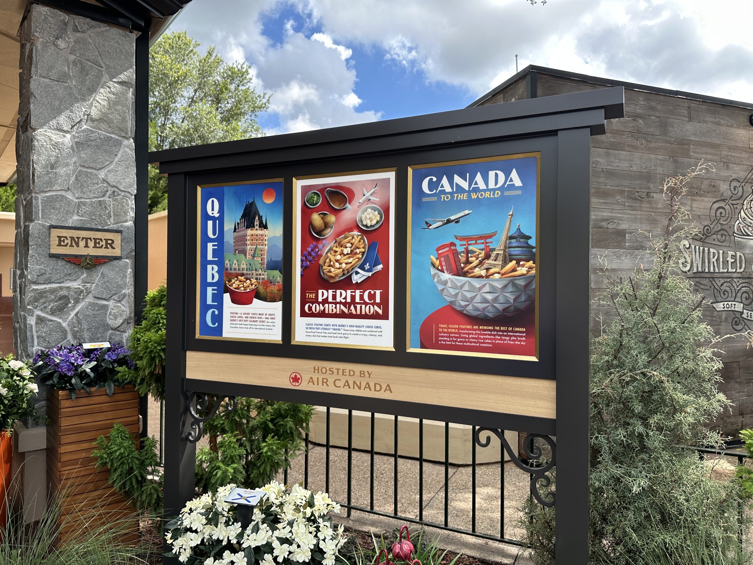 One sign advertises "Poutine Around the Globe," with artwork of a plane flying over World Showcase. A sign on the other side of the features travel-style posters featuring poutine and the Canada pavilion's Hotel du Canada.