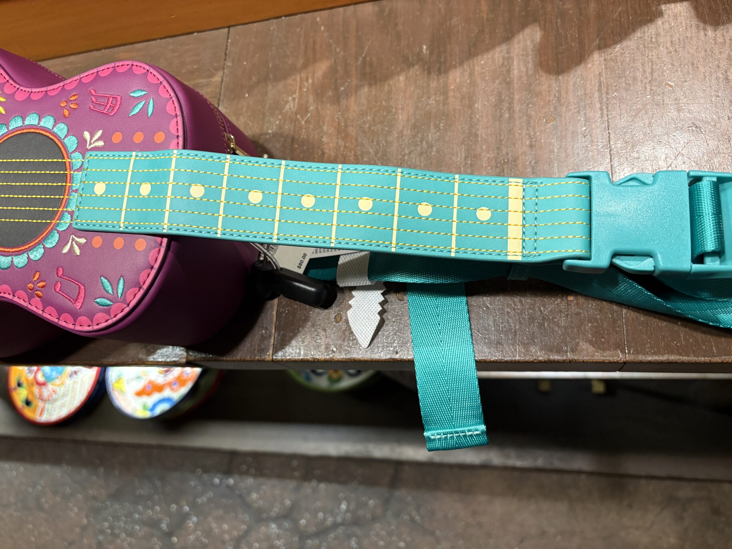 A guitar-shaped Loungefly crossbody bag featuring the Three Caballeros has arrived at EPCOT. We spotted it in Plaza de Los Amigos in the Mexico pavilion.