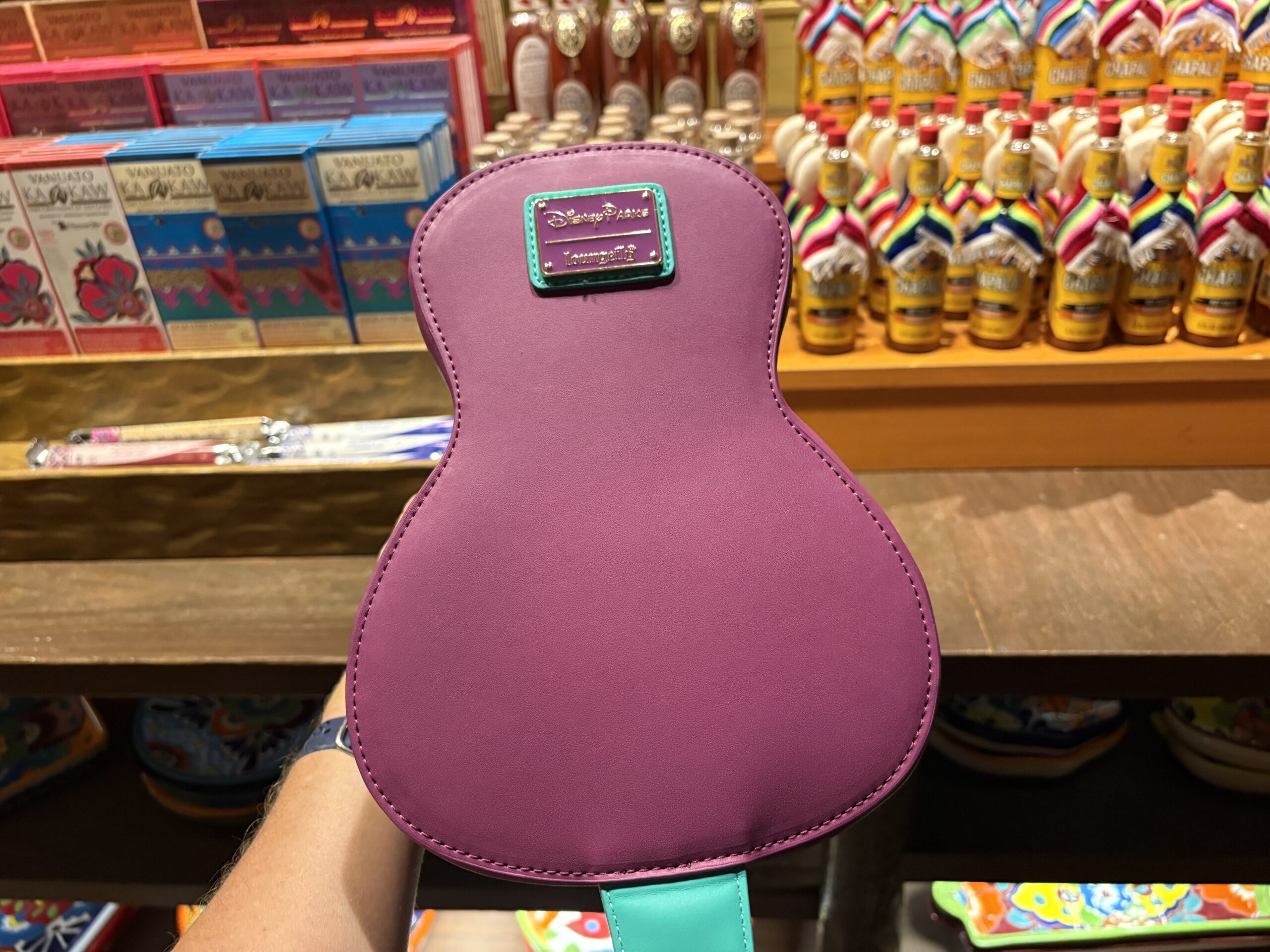 A guitar-shaped Loungefly crossbody bag featuring the Three Caballeros has arrived at EPCOT. We spotted it in Plaza de Los Amigos in the Mexico pavilion.