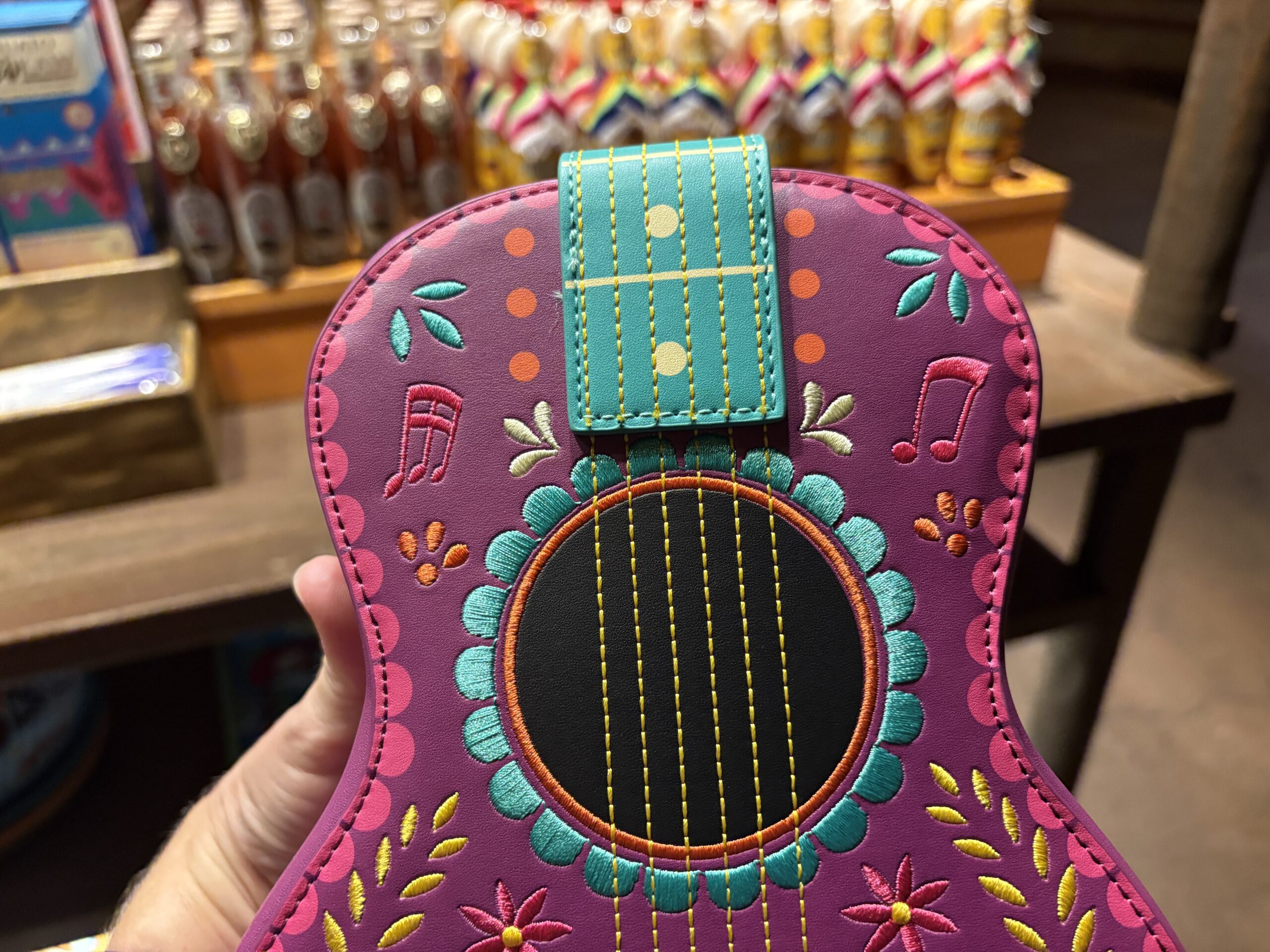 A guitar-shaped Loungefly crossbody bag featuring the Three Caballeros has arrived at EPCOT. We spotted it in Plaza de Los Amigos in the Mexico pavilion.