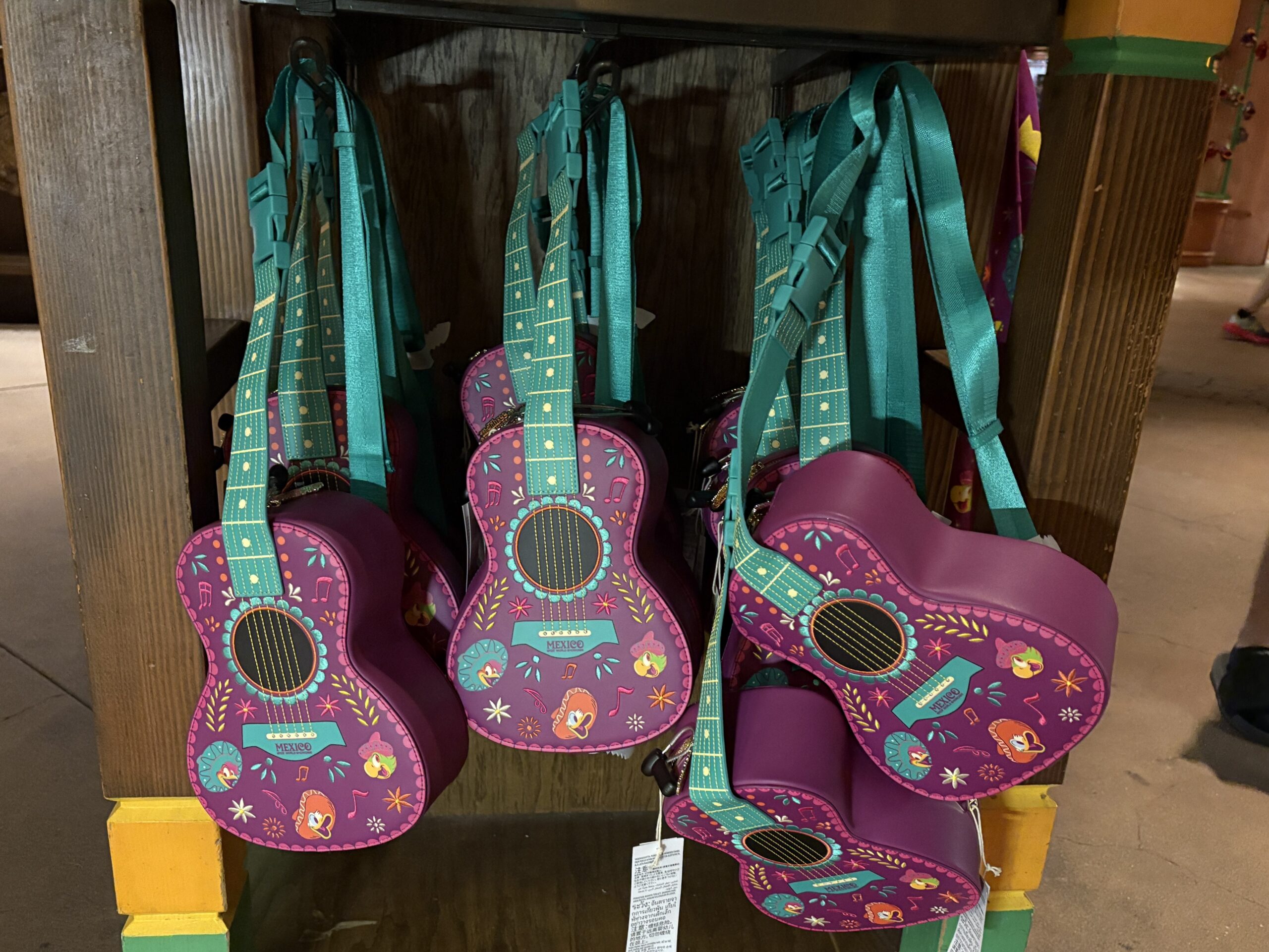 A guitar-shaped Loungefly crossbody bag featuring the Three Caballeros has arrived at EPCOT. We spotted it in Plaza de Los Amigos in the Mexico pavilion.