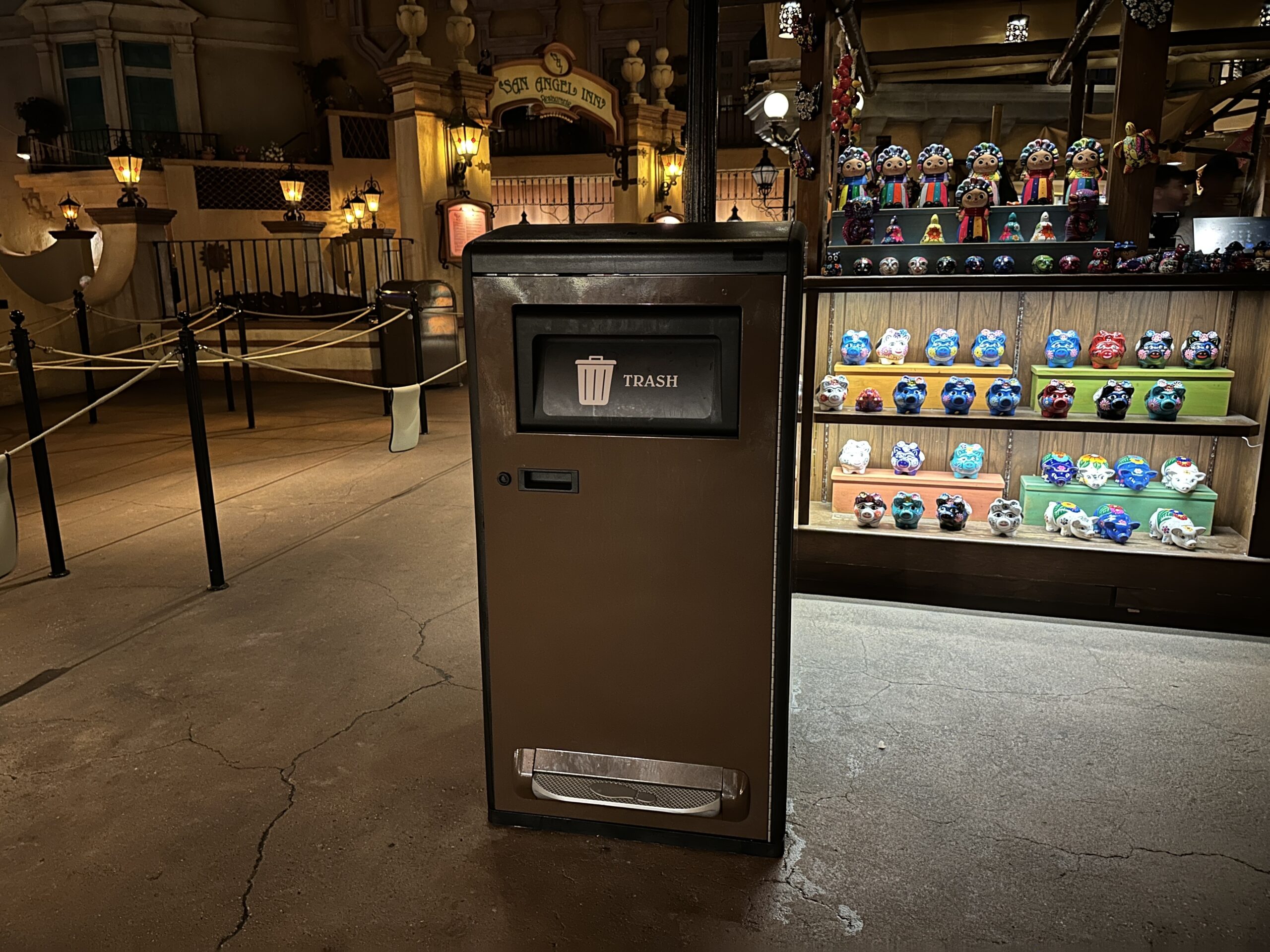 This new Mexico pavilion trash can looks just like the solar-powered ones but is lacking the solar panels on top. That's because it's inside, so won't be getting any sunlight. The solar panels on the outdoor cans power an interior trash compactor.