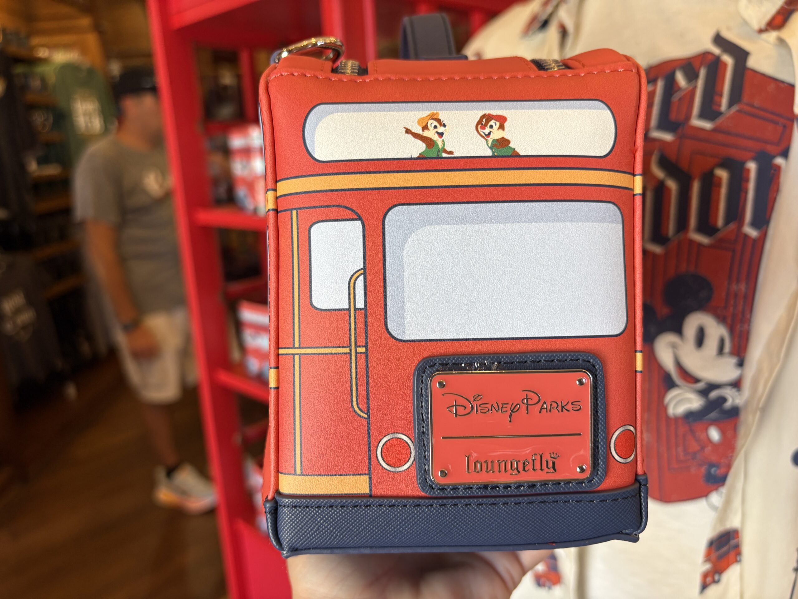 The front of the bus is a small zip pouch. On the back is the Disney Parks | Loungefly label plate.