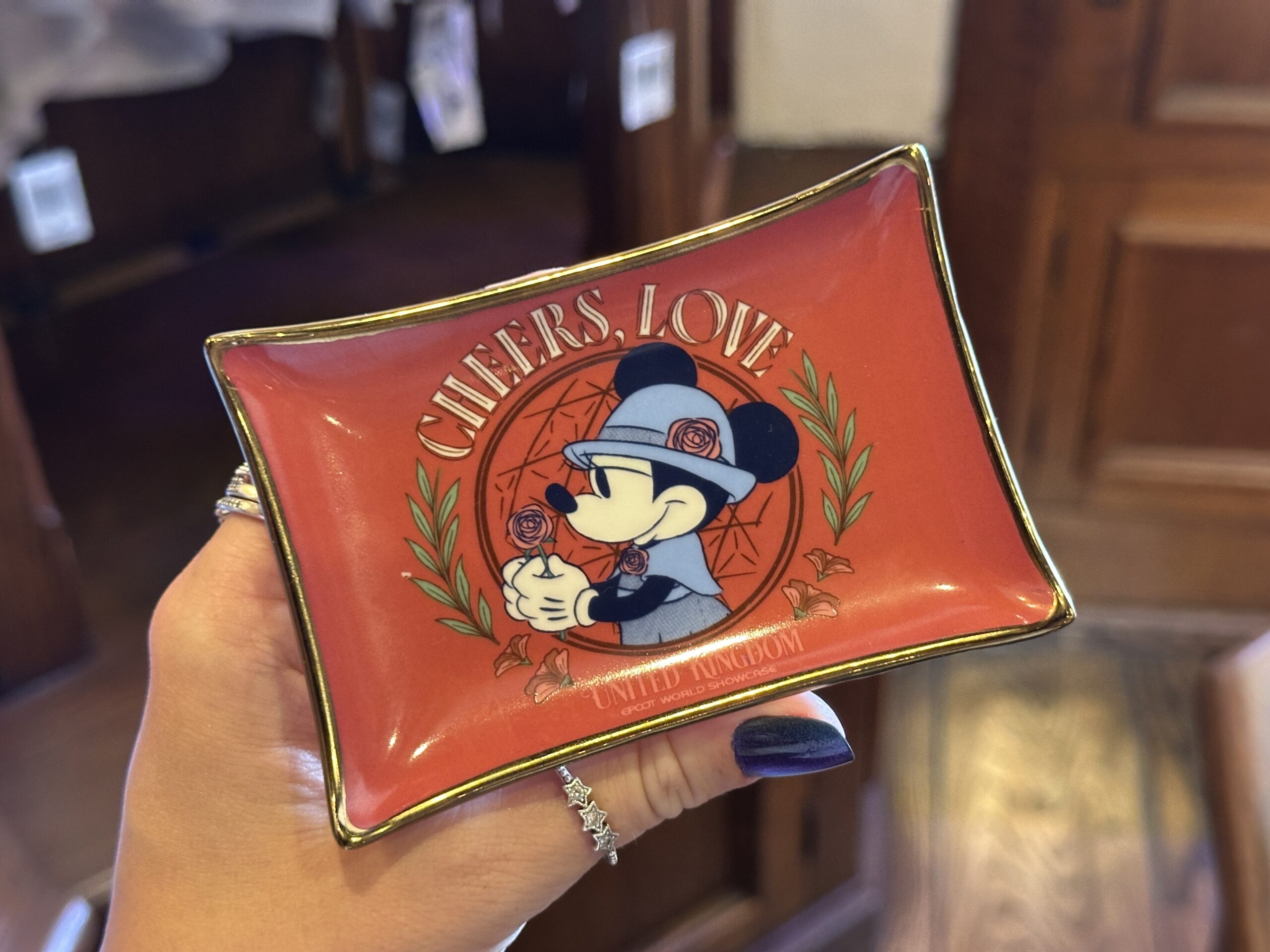 This tray is red with a metallic gold edge. Similar artwork as the adult t-shirt is in the center, with the addition of "Cheers, Love" across the top.
