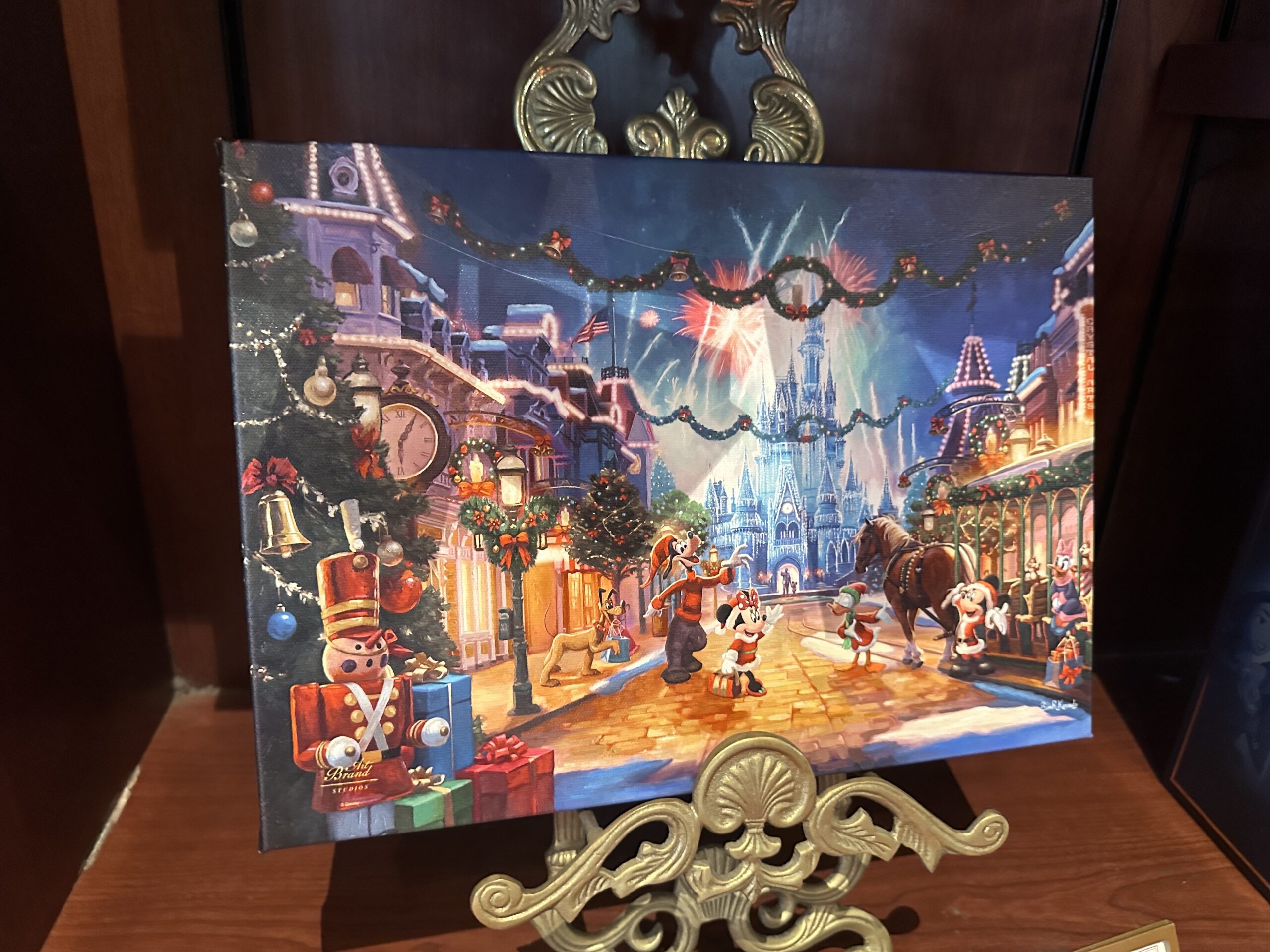 An art print depicting Christmas at Magic Kingdom (at least how Christmas used to look) is available at the park even though it's early July.