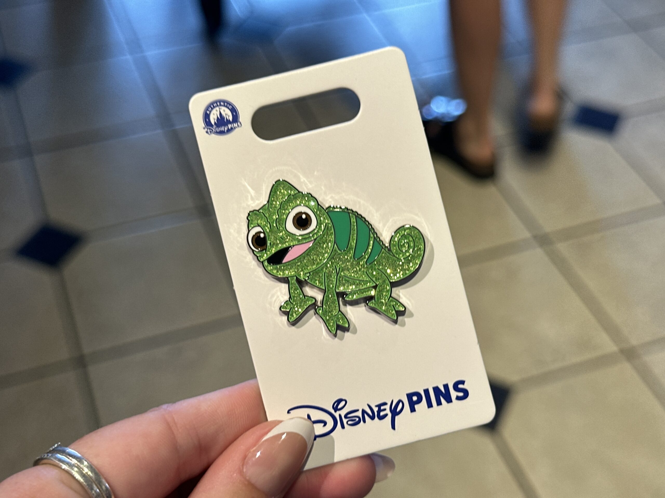 Rapunzel's best friend, Pascal, has a glittery green finish except for his eyes, mouth, and stripes.