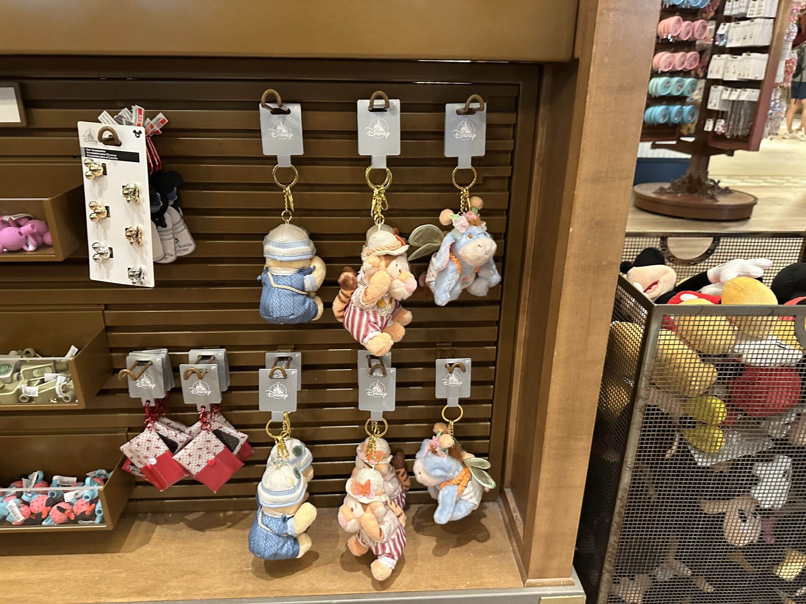 Plush keychains of Winnie the Pooh, Tigger, and Eeyore in summer outfits have arrived at Walt Disney World.