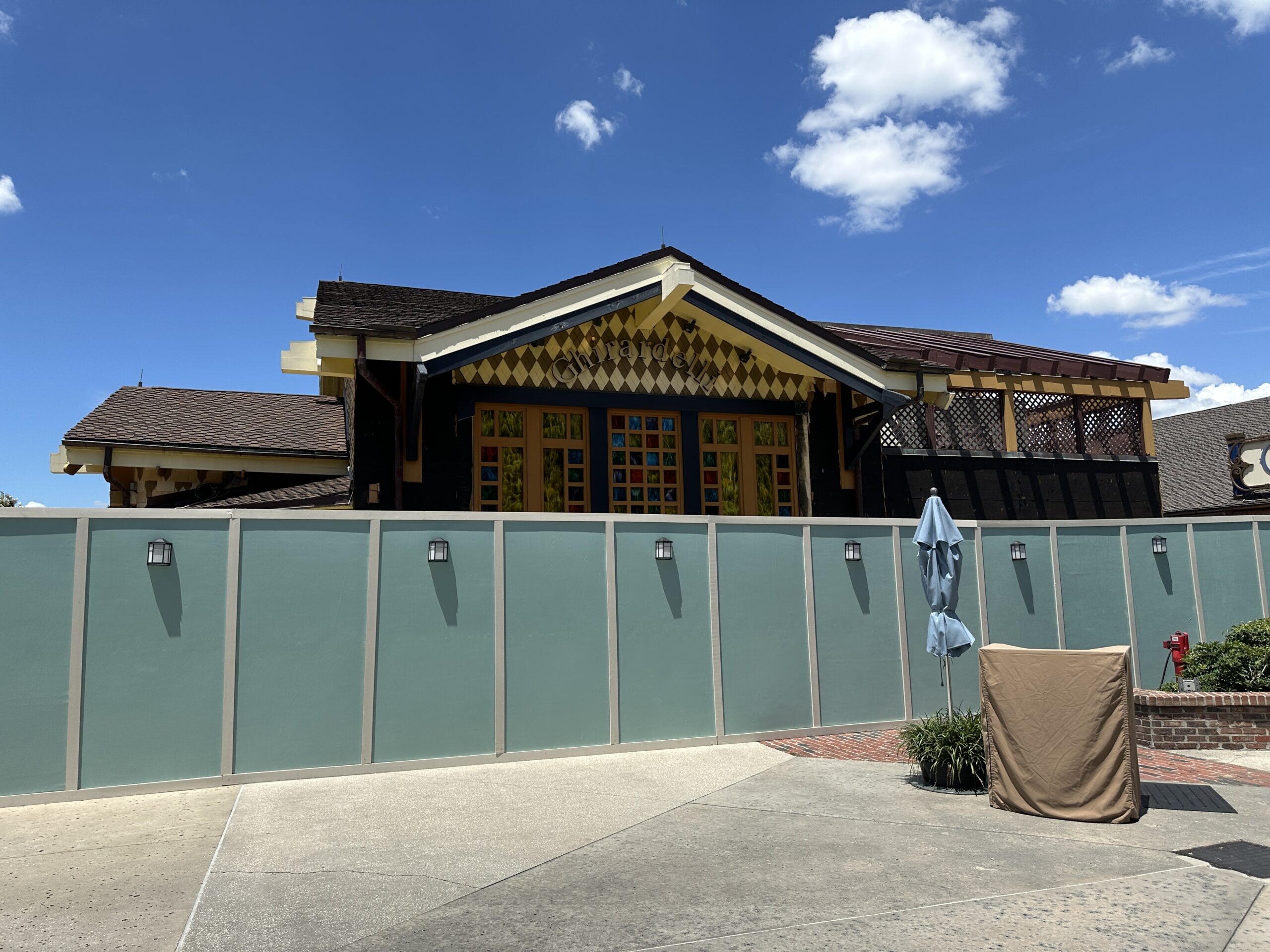 Similar paneling was removed from around stained glass windows. The harlequin print paneling and Ghirardelli sign remain above the windows. There's a mural beneath these windows but we can't see it over the construction walls.