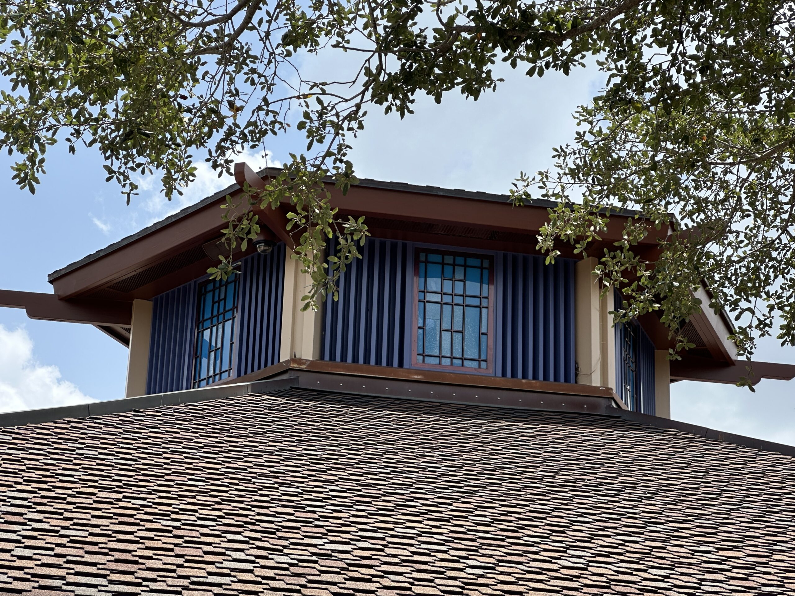 The repainting of Disney's Pin Traders at Disney Springs appears to be complete. The painting project began in June and has turned the formerly orange building blue.