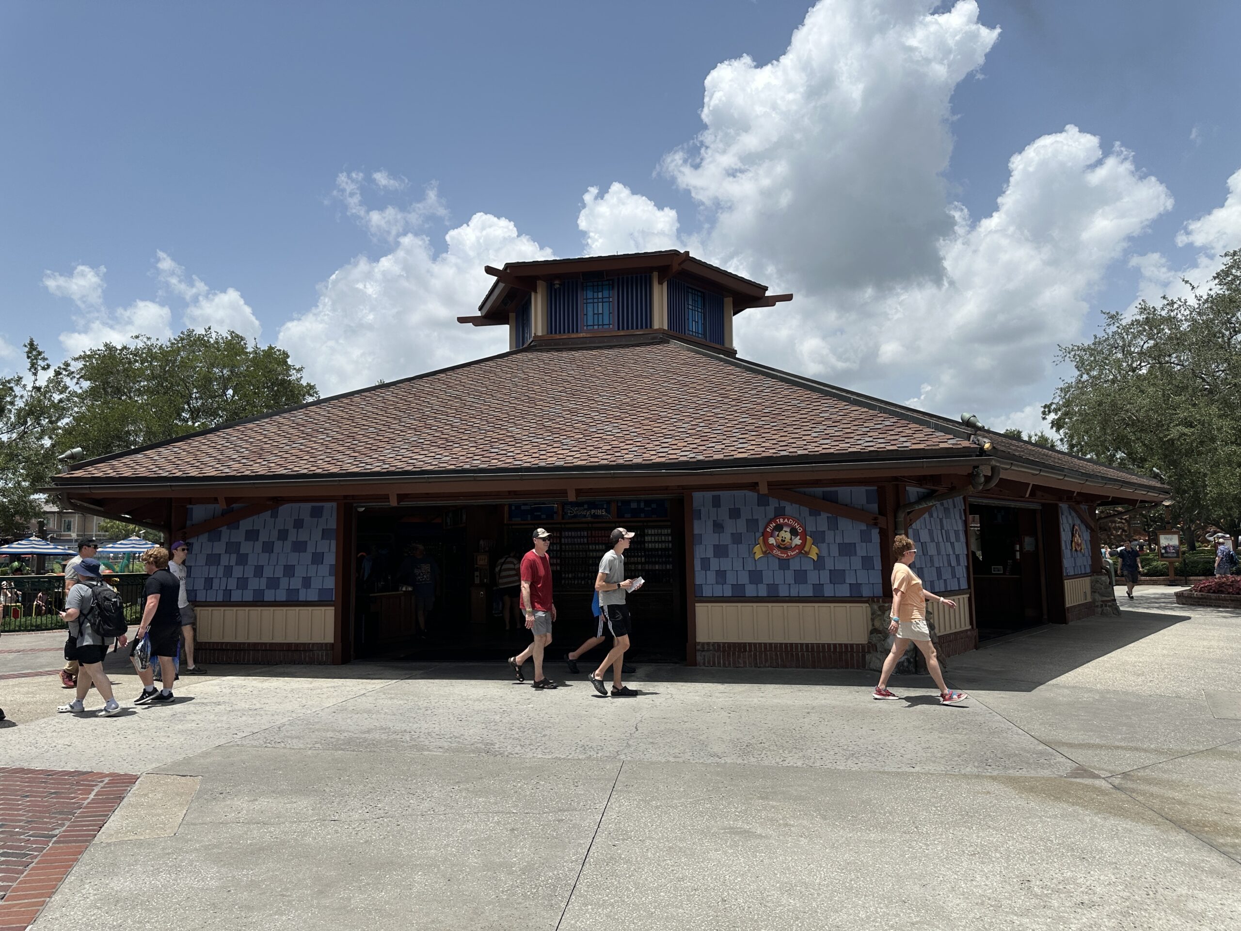 The repainting of Disney's Pin Traders at Disney Springs appears to be complete. The painting project began in June and has turned the formerly orange building blue.