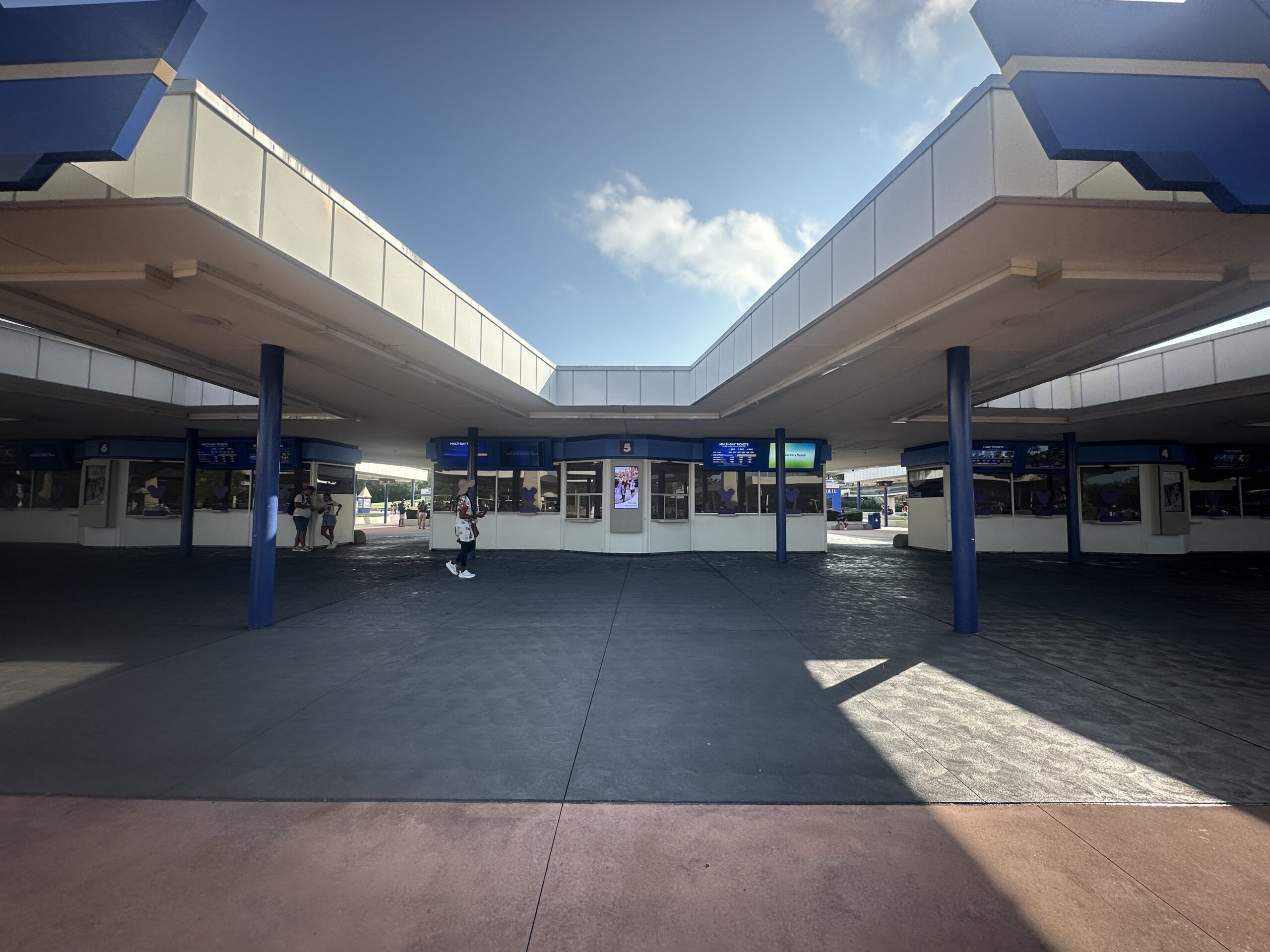 Although the ground in front of the ticket booths was freshly paved last year (and railings were removed), the pavement has been re-done. We speculated when the walls went back up that Disney was going to refurbish the ticket booths themselves but that doesn't seem to be the case.