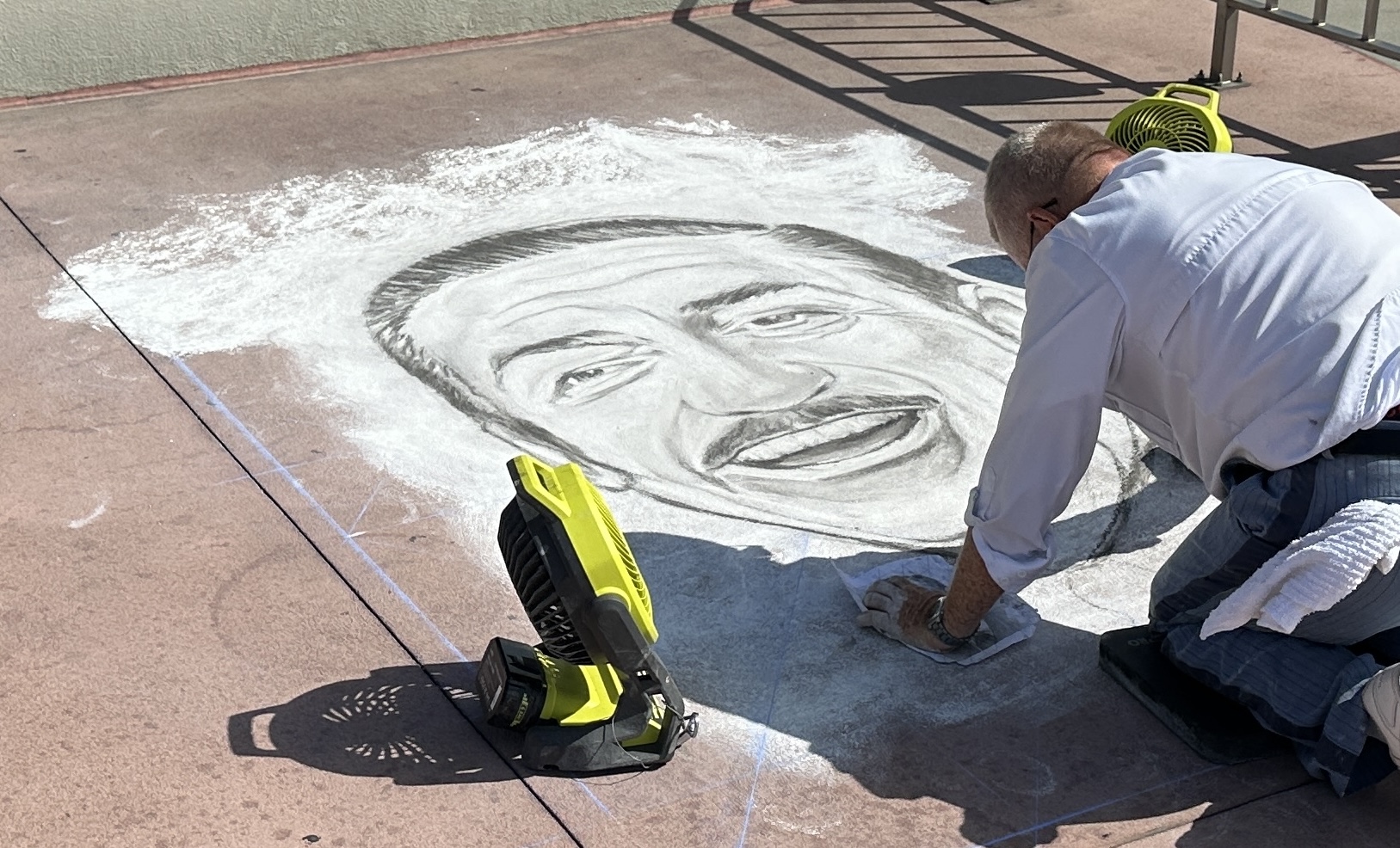 Chalk art at Walt Disney World is usually reserved for the EPCOT International Festival of the Arts but on July 21, we saw an artist finalizing a detailed chalk portrait of Walt Disney at the Transportation and Ticket Center.