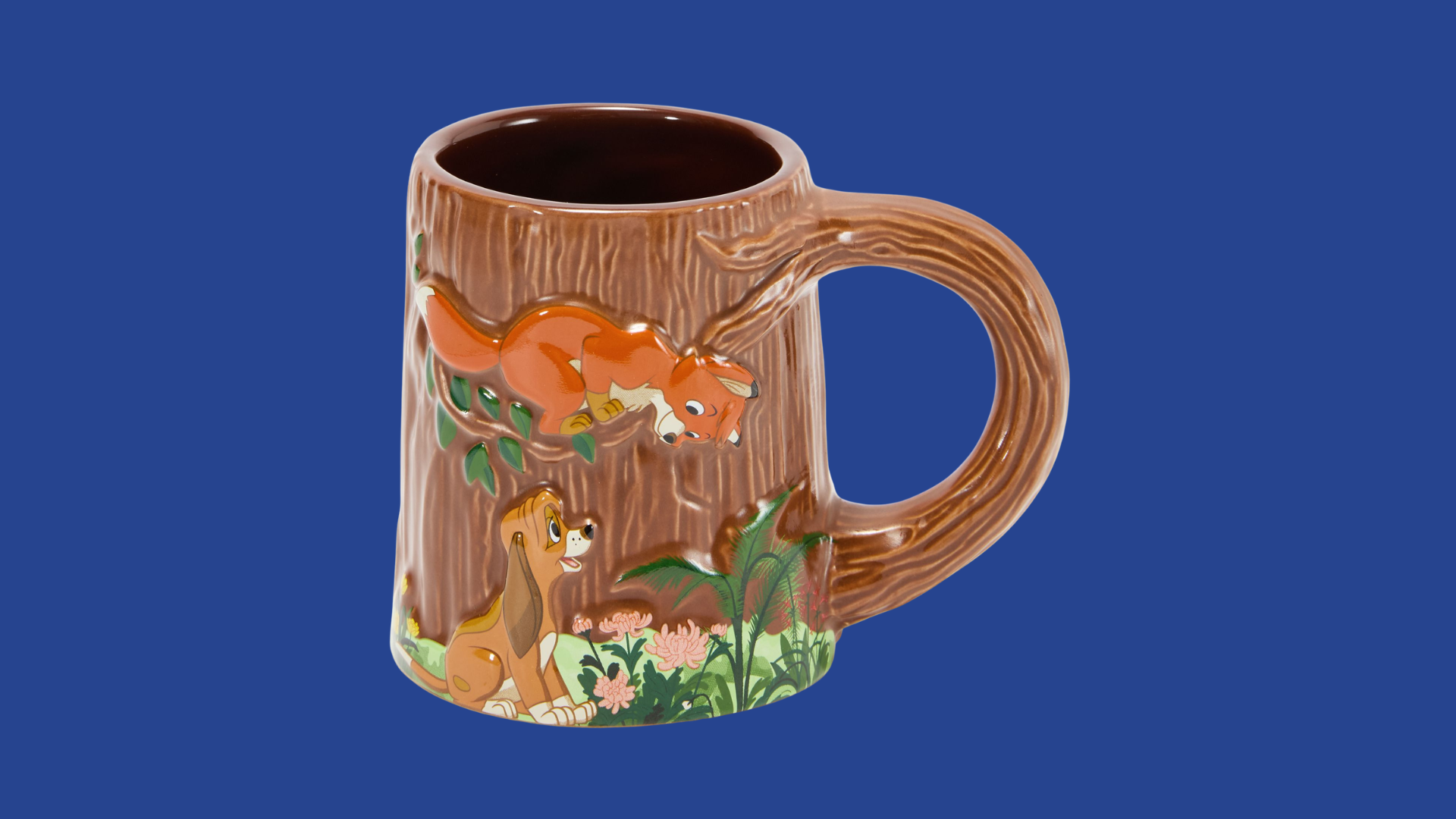 An item that every fan needs is the Fox and the Hound 45th Anniversary Mug, with a detailed design showing Canine companions Tod and Cooper caught in a playful scene. It’s perfect for sipping your morning brew or for enjoying an afternoon pick-me-up.