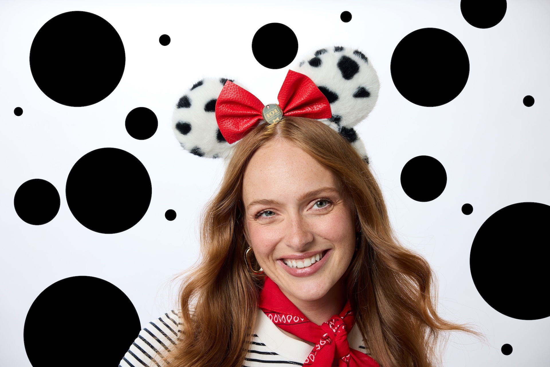 Looking to add a new ear headband to your growing collection? The 101 Dalmatians Ear Headband for Adults is made of soft plush material, with white and black spotted faux fur and a red pebbled faux leather bow that is complete with a golden dog tag charm (etched with the film’s logo for extra detail).