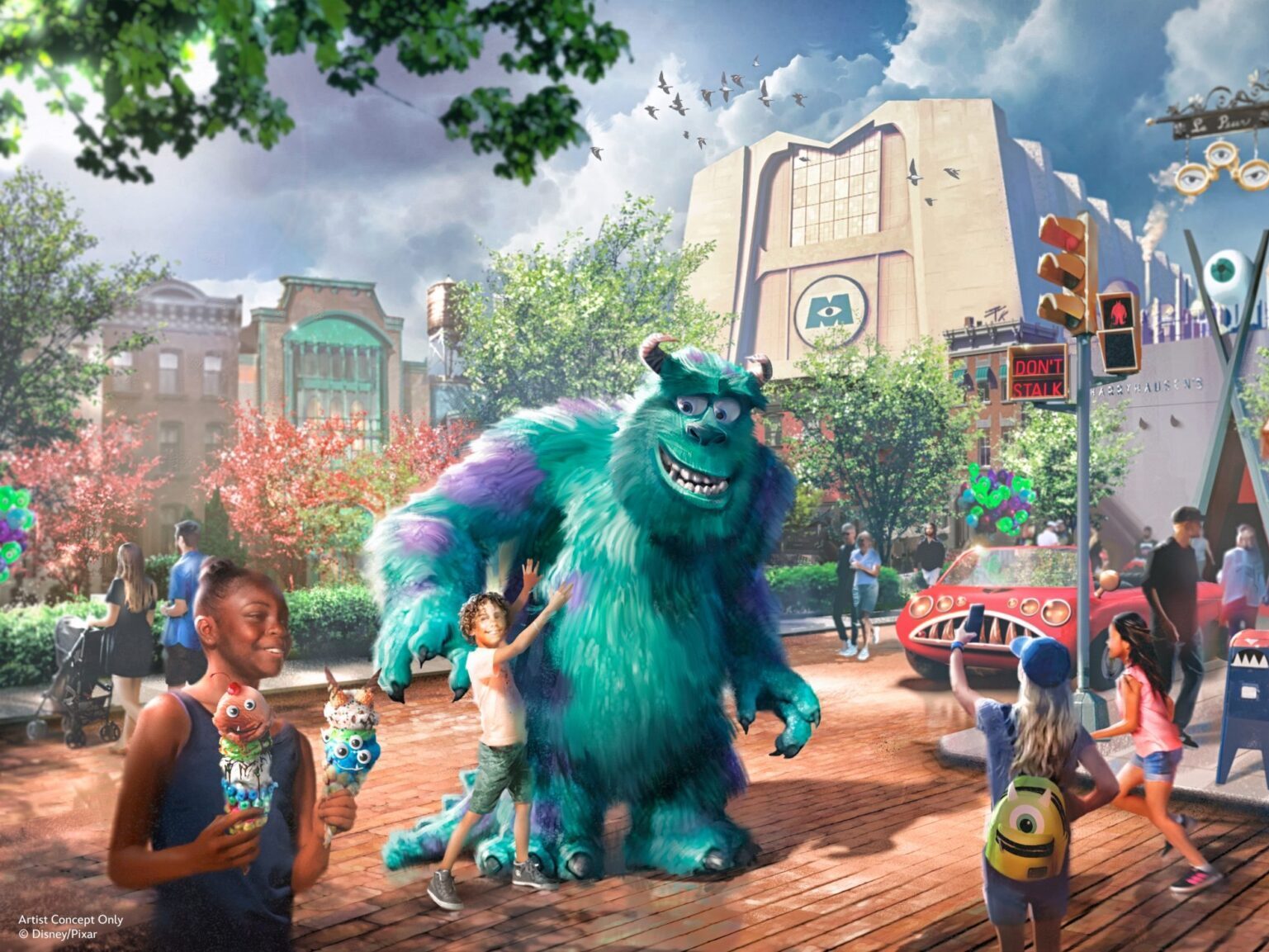 People enjoying a lively theme park at Disney's Hollywood Studios with a large blue and purple monster character, various shops, and a street filled with vibrant decorations and excited visitors.