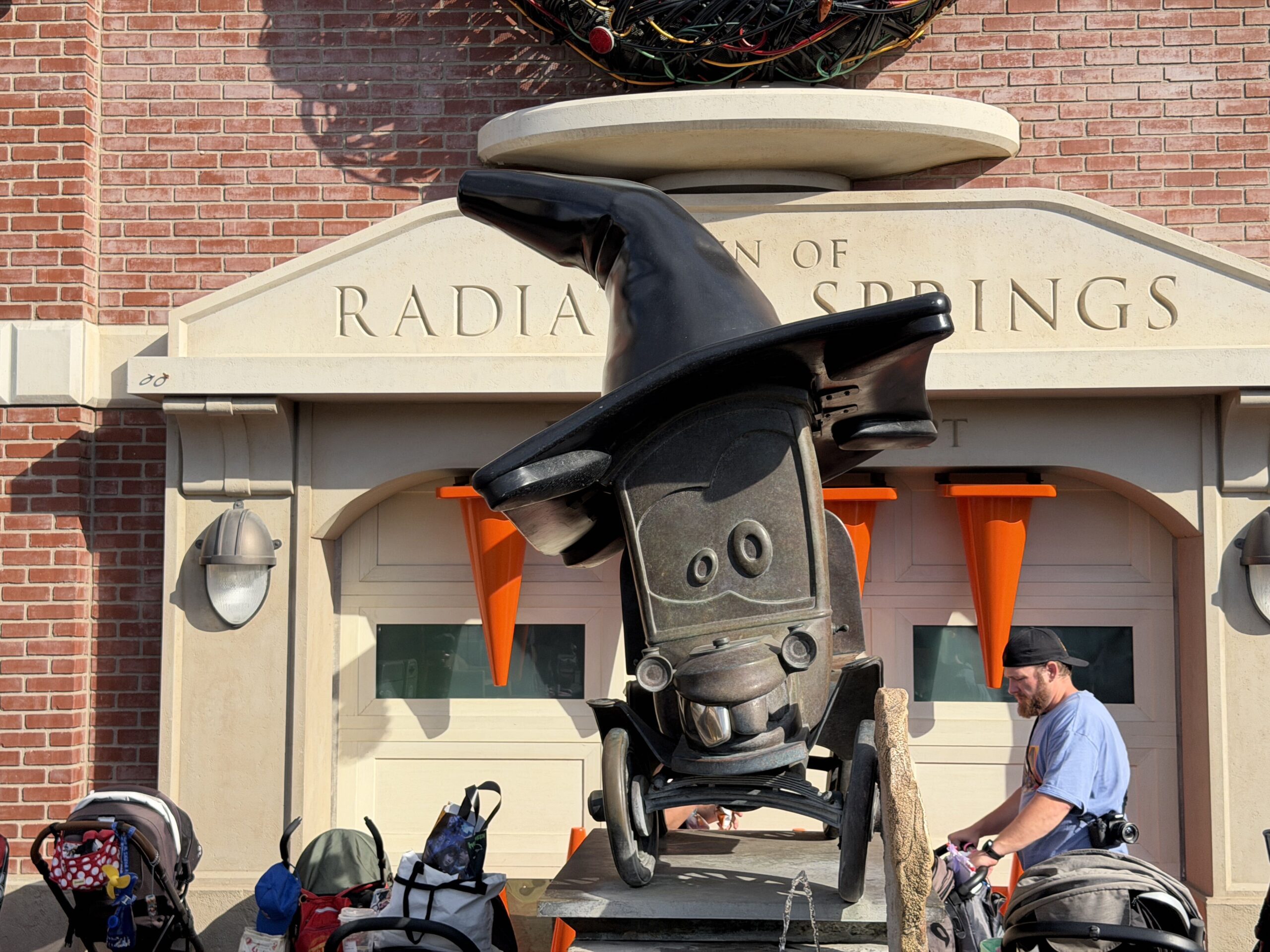 Stanley's Statue stands proudly with a black traffic cone witch's hat, encouraging playful spooks throughout the land.