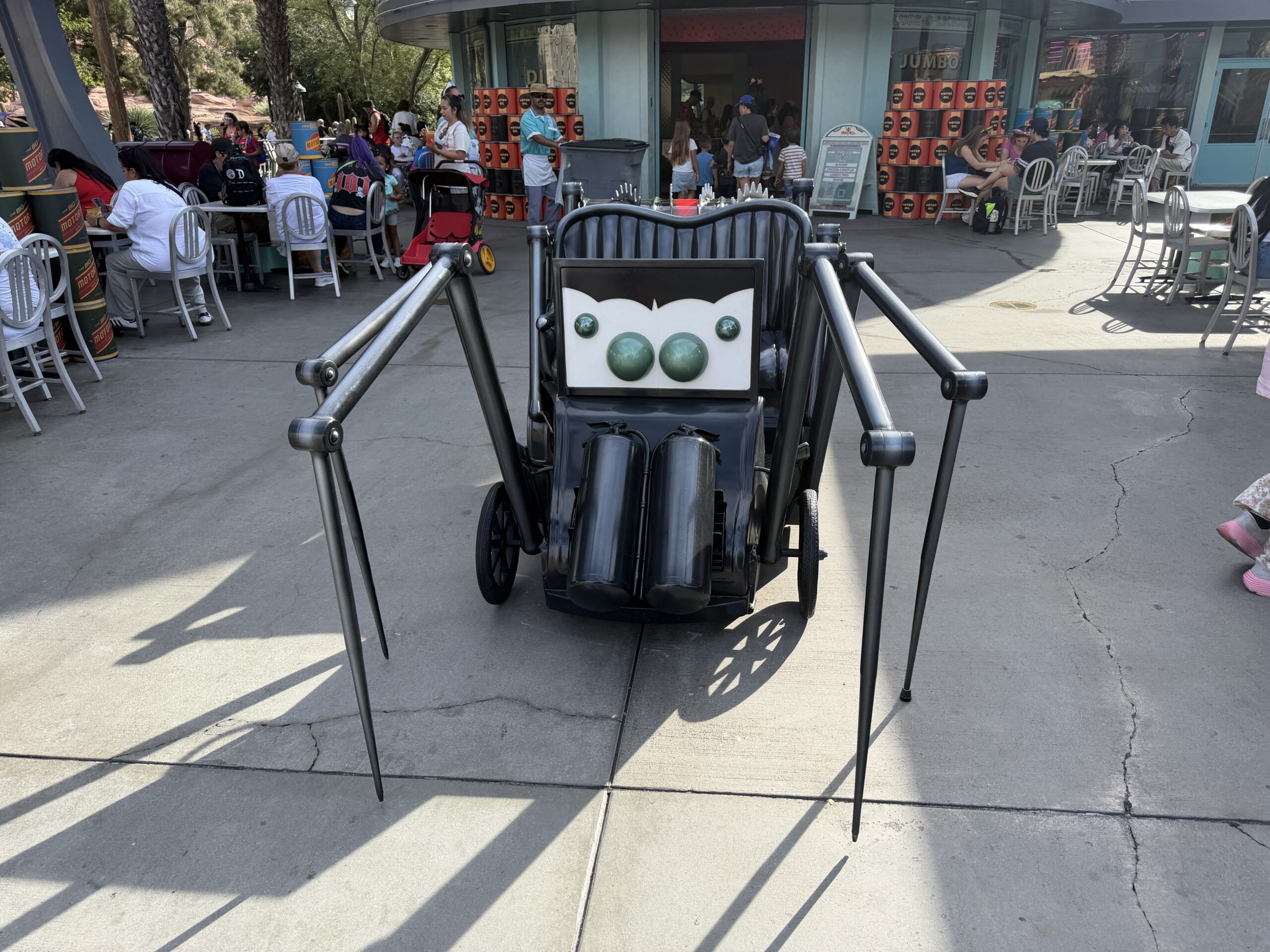 An old, spider-like jalopy waits for a bite outside of Flo's V8 Cafe.