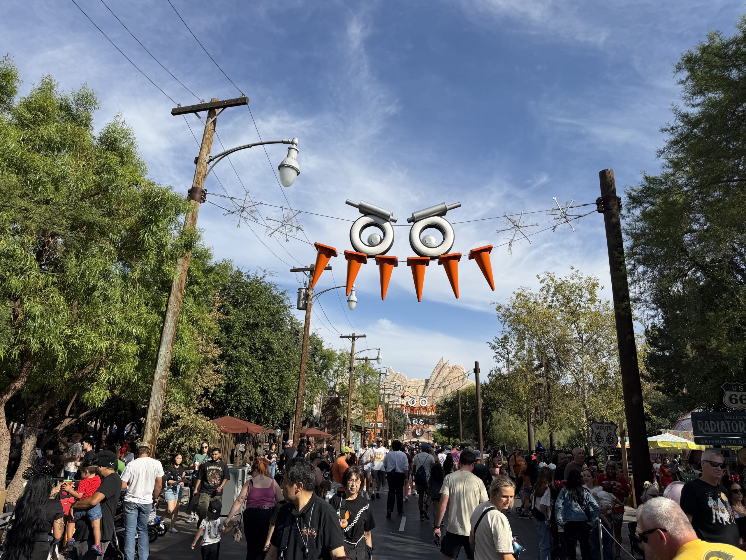 Tires and cones strung from phone poles make a scary face hanging above guests walking throughout the streets.