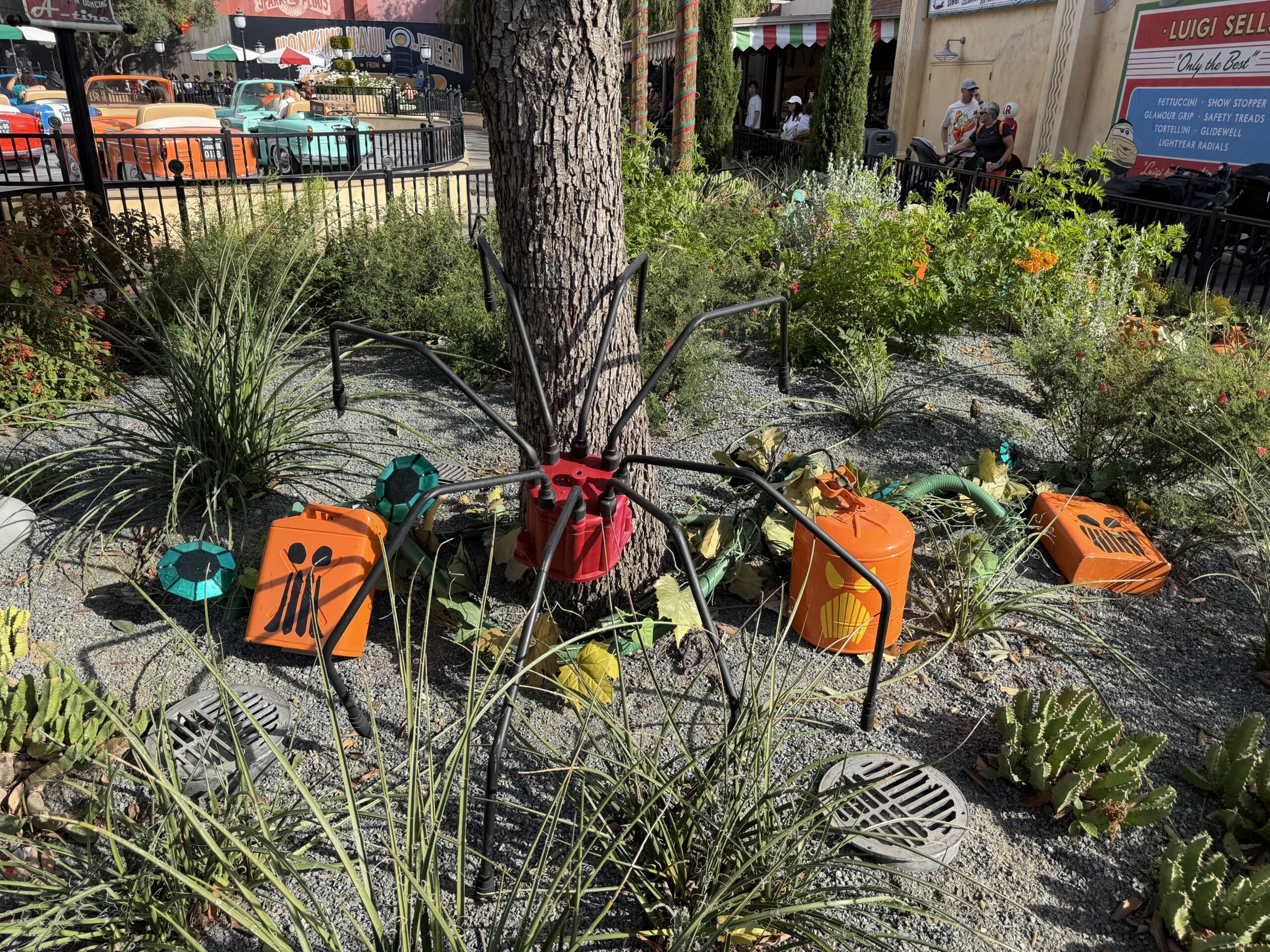 Pumpkin-faced batteries are wired as though growing from vines in the ground, and oil can spiders climb trees and scurry about.