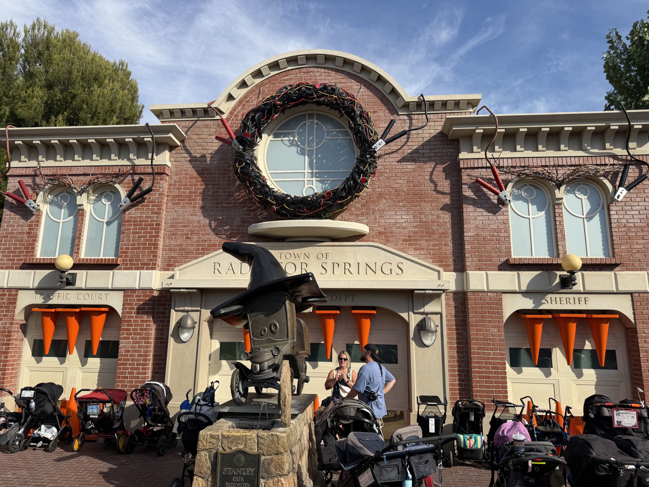 Stanley's Statue stands proudly with a black traffic cone witch's hat, encouraging playful spooks throughout the land.