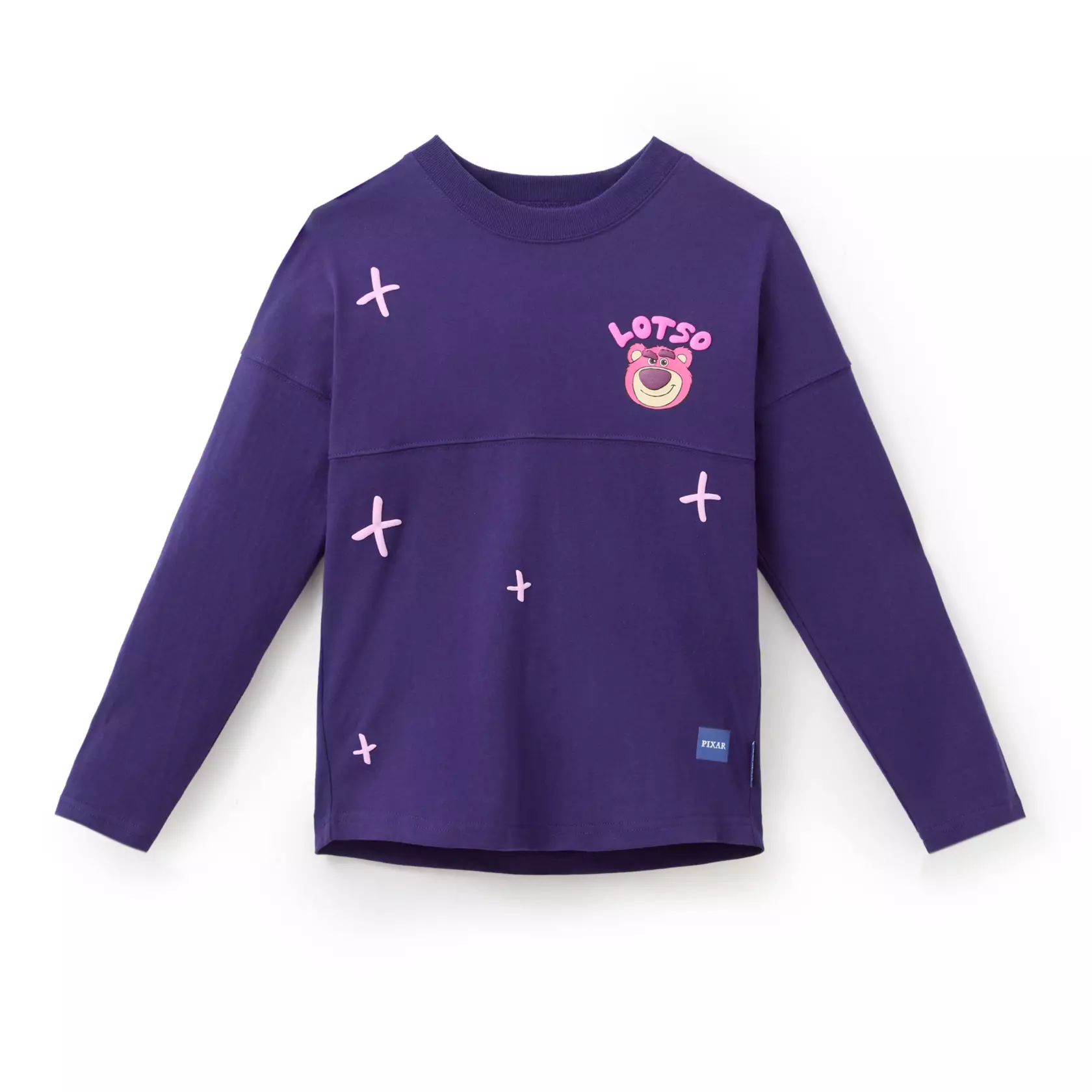 Inspired by Lots-o'-Huggin' Bear from Toy Story 3, this purple jersey is adorned with puffy ink details and screen art of Lotso smirking on the chest. An embroidered chenille and satin appliqué of the pink bear is on the back with "Cuteness is my disguise" in puffy ink.