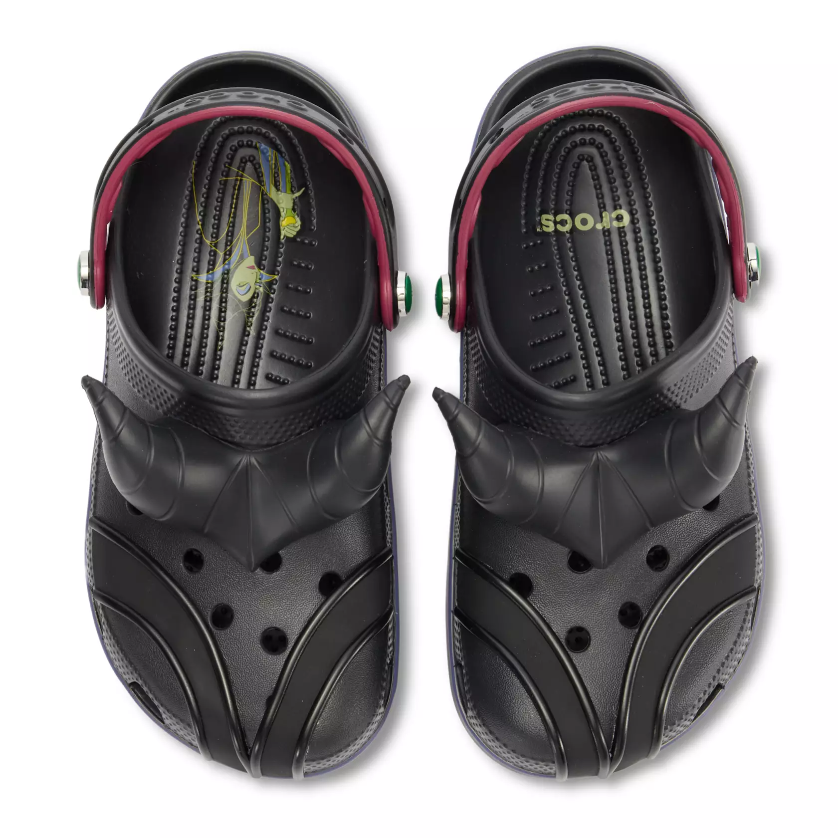 These black clogs have sleek details with Maleficent's horns on top. Purple and green flames are down the sides. The straps have red edges and green gems.