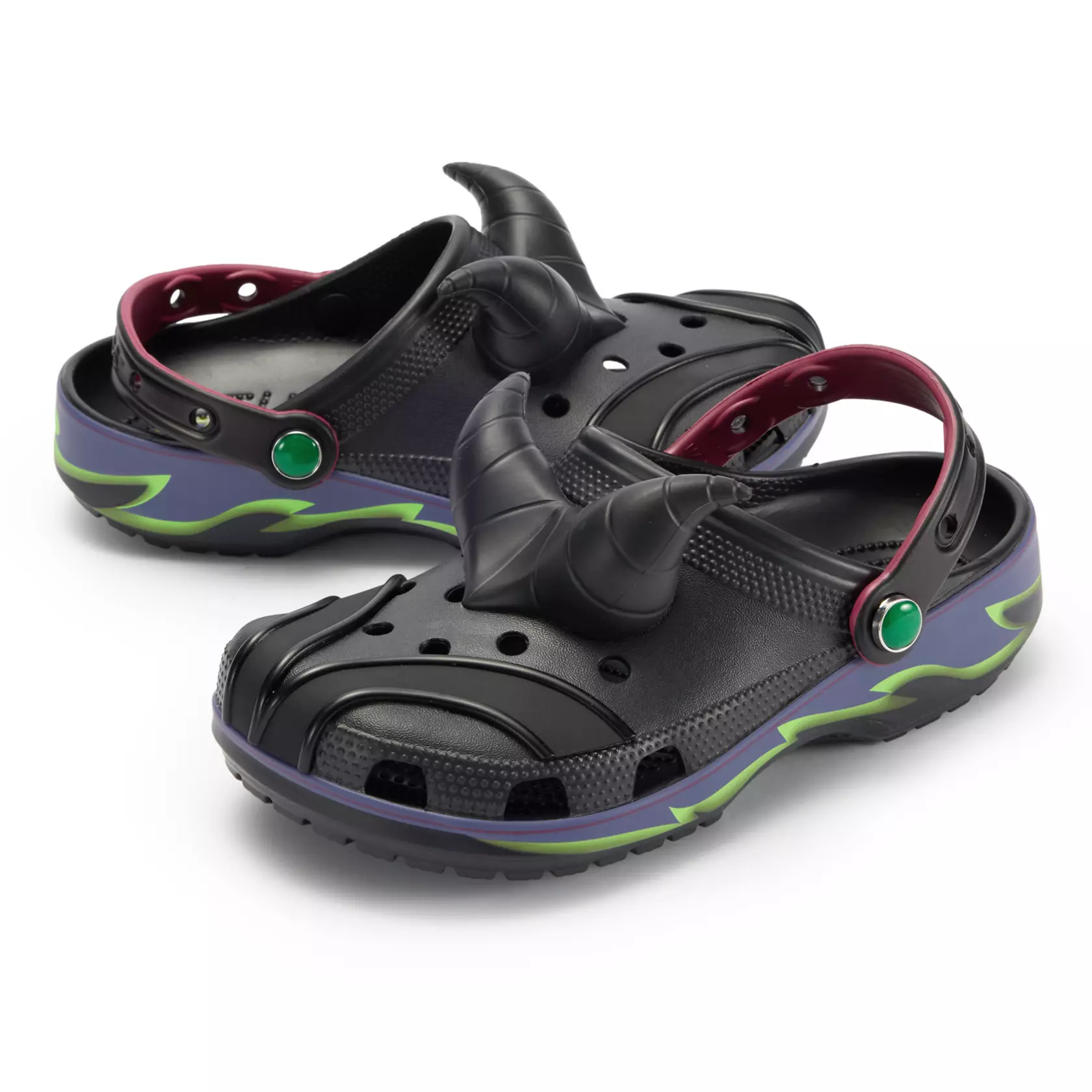 These black clogs have sleek details with Maleficent's horns on top. Purple and green flames are down the sides. The straps have red edges and green gems.