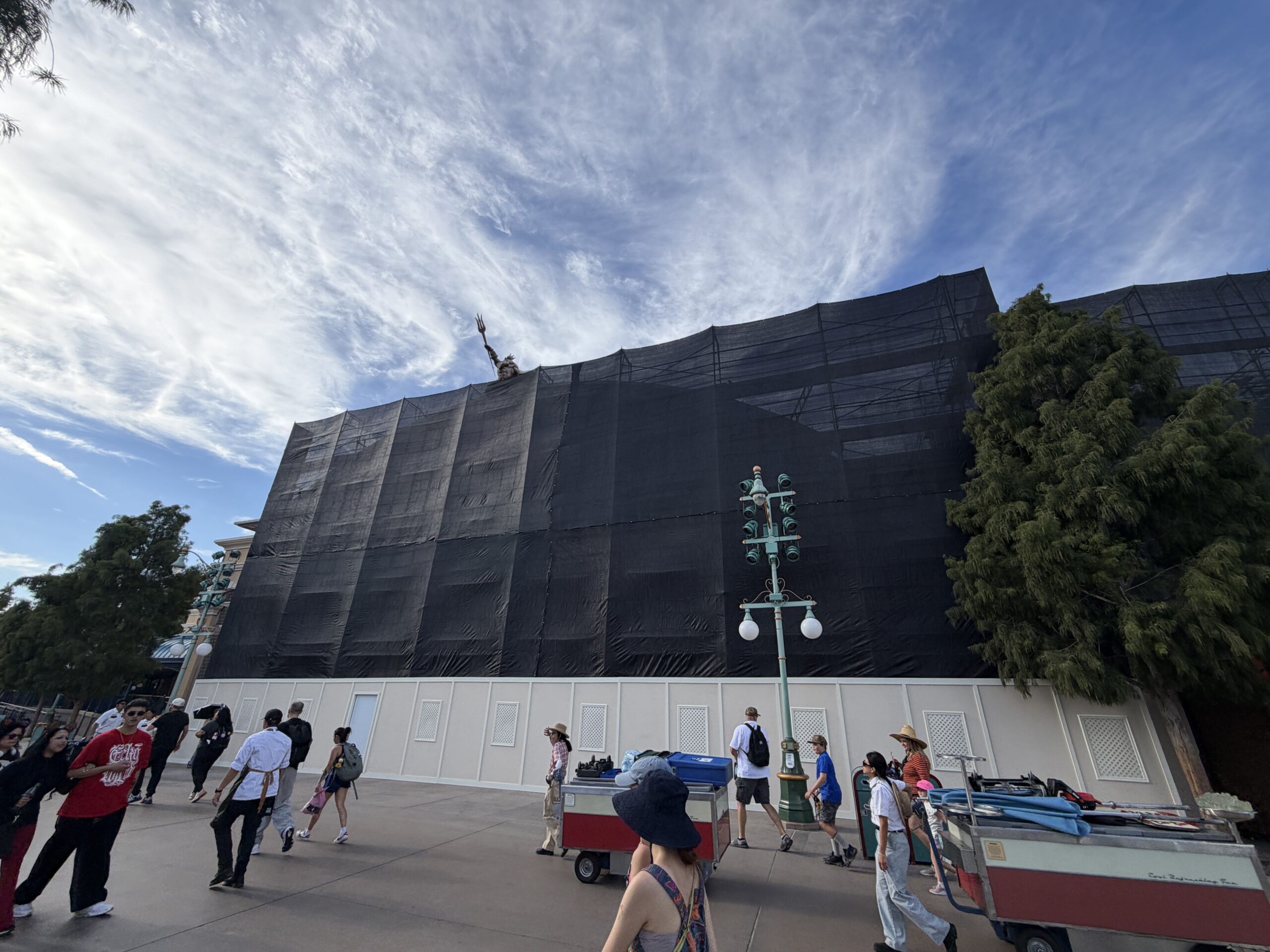 The Little Mermaid ~ Ariel’s Undersea Adventure at Disney California Adventure is completely surrounded by construction walls, scaffolding, and black scrims.