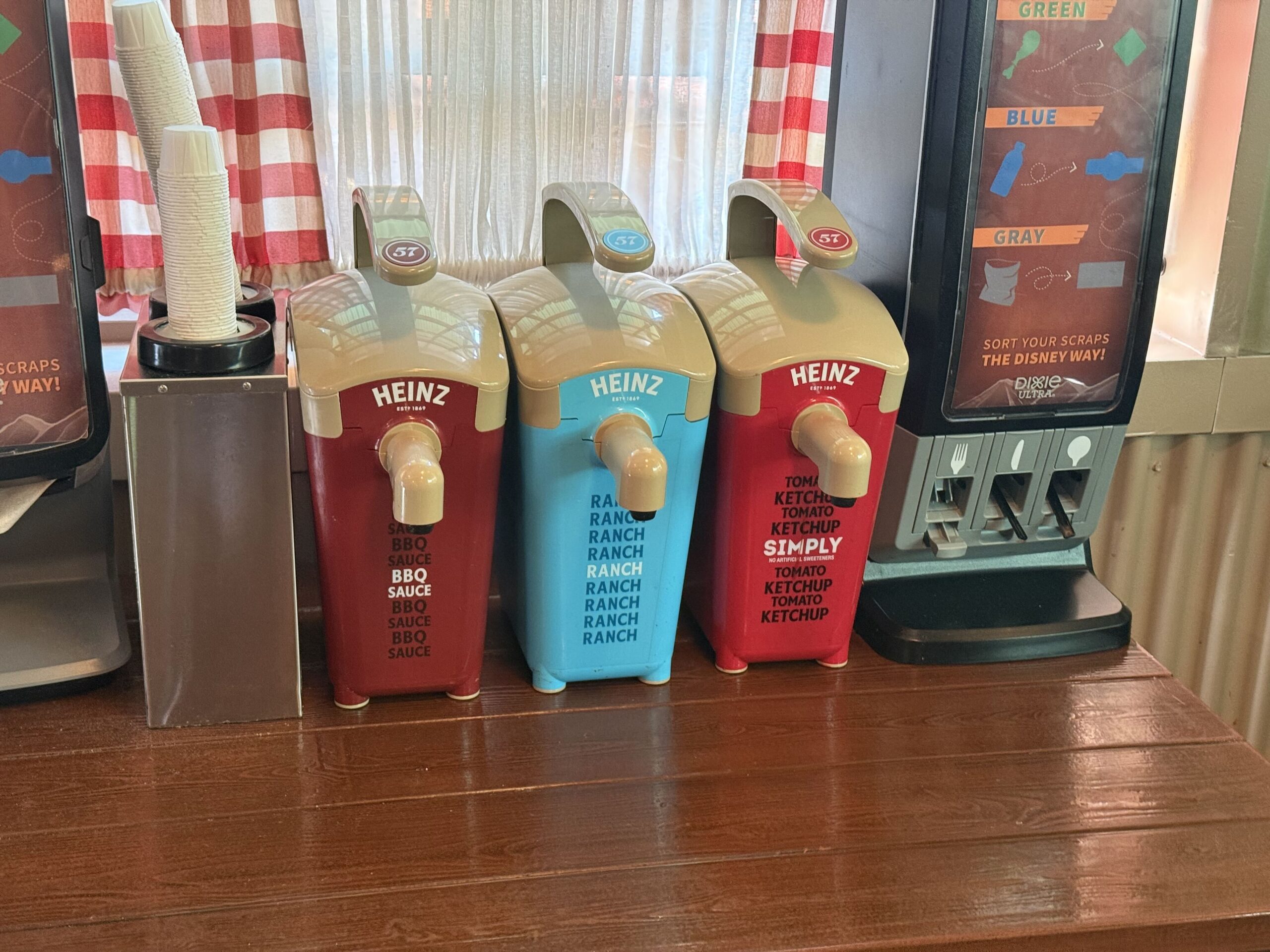 We found the new Heinz condiment dispensers at Smokerjumpers Grill in Disney California Adventure. The three flavors available for guests to use are BBQ sauce, ranch, and Simply tomato ketchup.