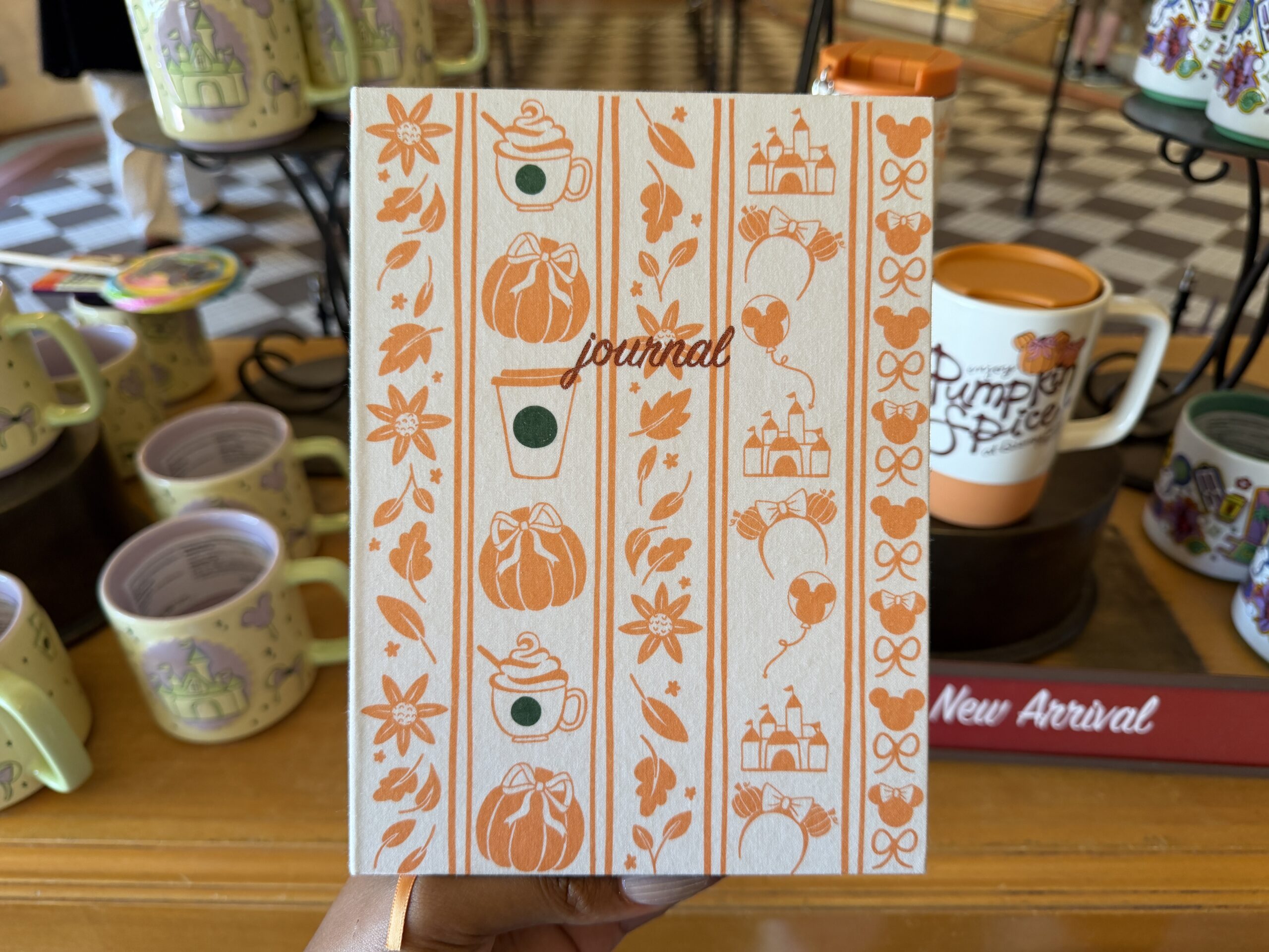 The journal cover features rows of orange autumnal icons. In red lowercase script is "journal".