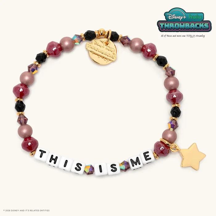 "THIS IS ME" is spelled out in white letter blocks, while the rest of the bracelet has red, pink, and black beads with gold spacers. A gold star charm is included with the bracelet.