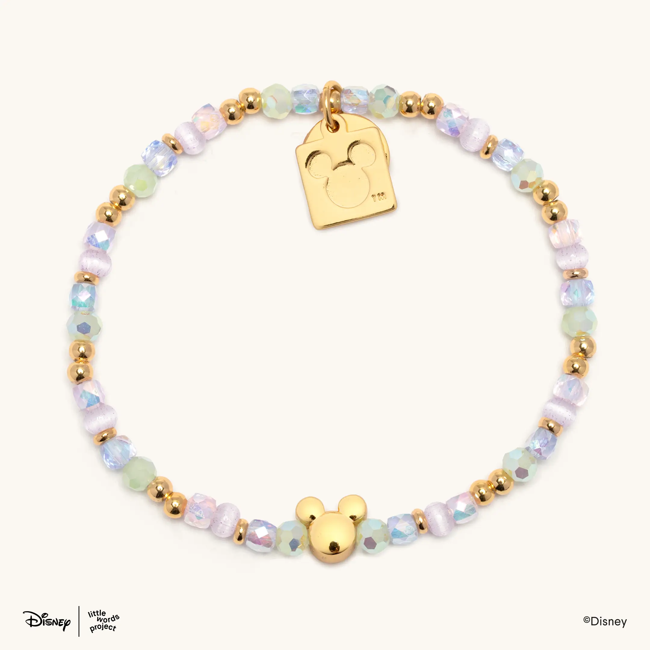 You can also add your own beads and charms to this bracelet base, which has green, pink, and gold beads, along with a gold Mickey head charm.