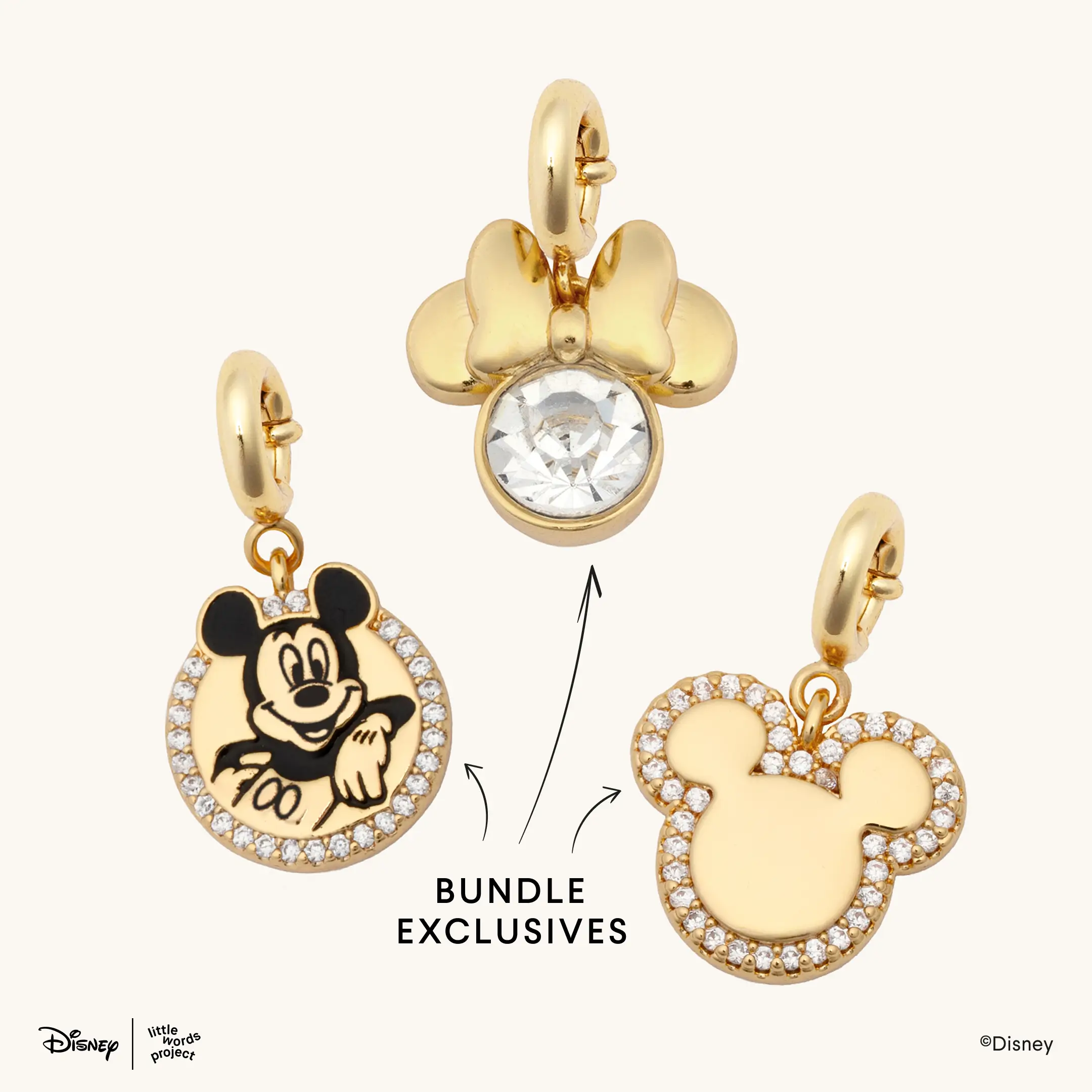 Those looking to just buy charms can purchase this bundle of three charms: a charm of Mickey Mouse posing in a bedazzled border, a Minnie head charm with a clear gem in the center of the head, and a gold Mickey head charm with a bedazzled border.