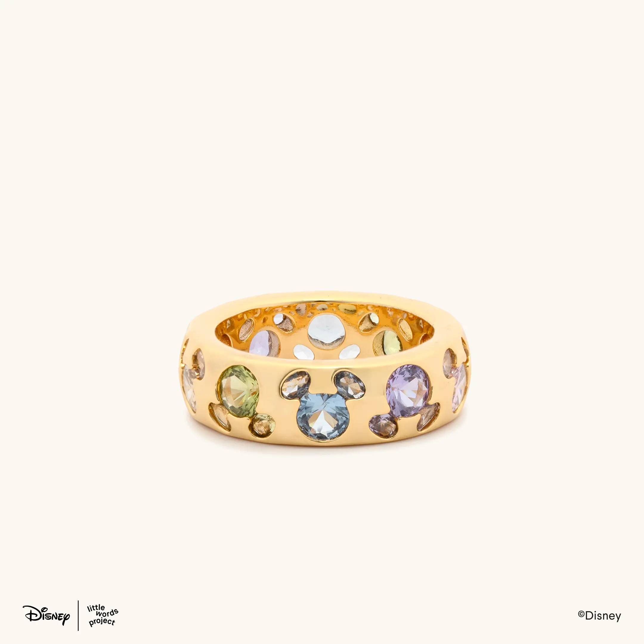 The rainbow Mickey design from the bracelet can also be found on this gold ring, which has Mickey head cut-outs filled with differently colored gems.