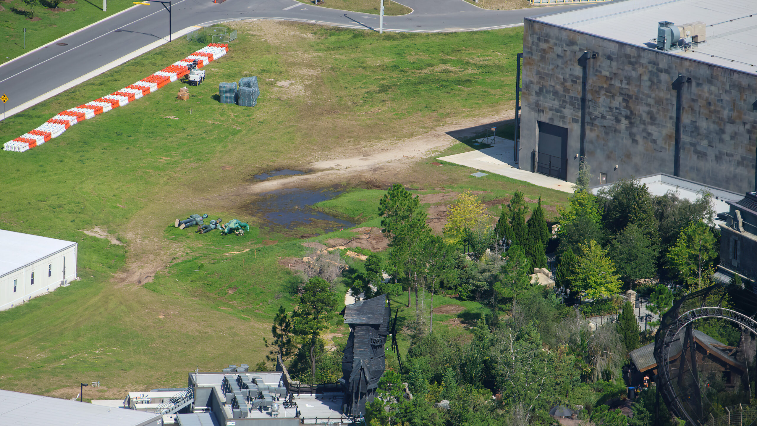 The cleared site is in the top left corner of the above photo, next to the Monsters Unchained show building. Dirt paths show where the tall trees used to be. They filled out the "forest" of Dark Universe.