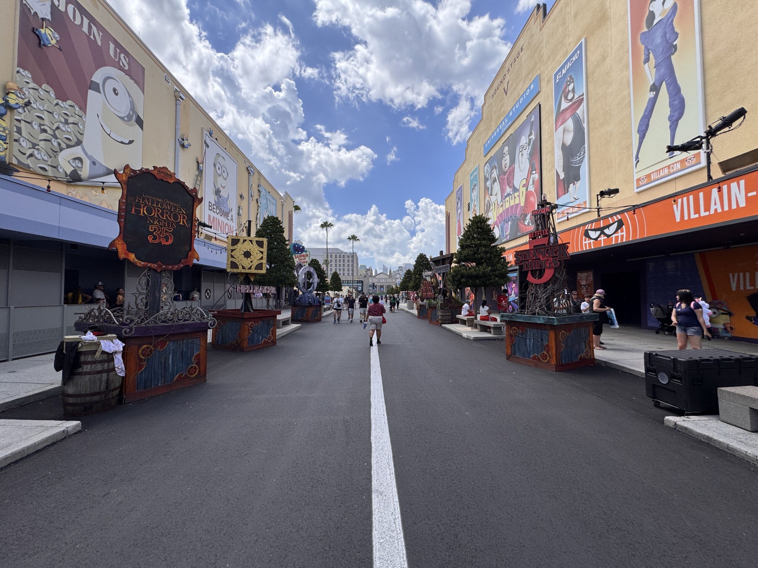 Moving into Minion Land, there are signs and icons representing each of this year's haunted houses, sitting atop bases that match the carnival theming.