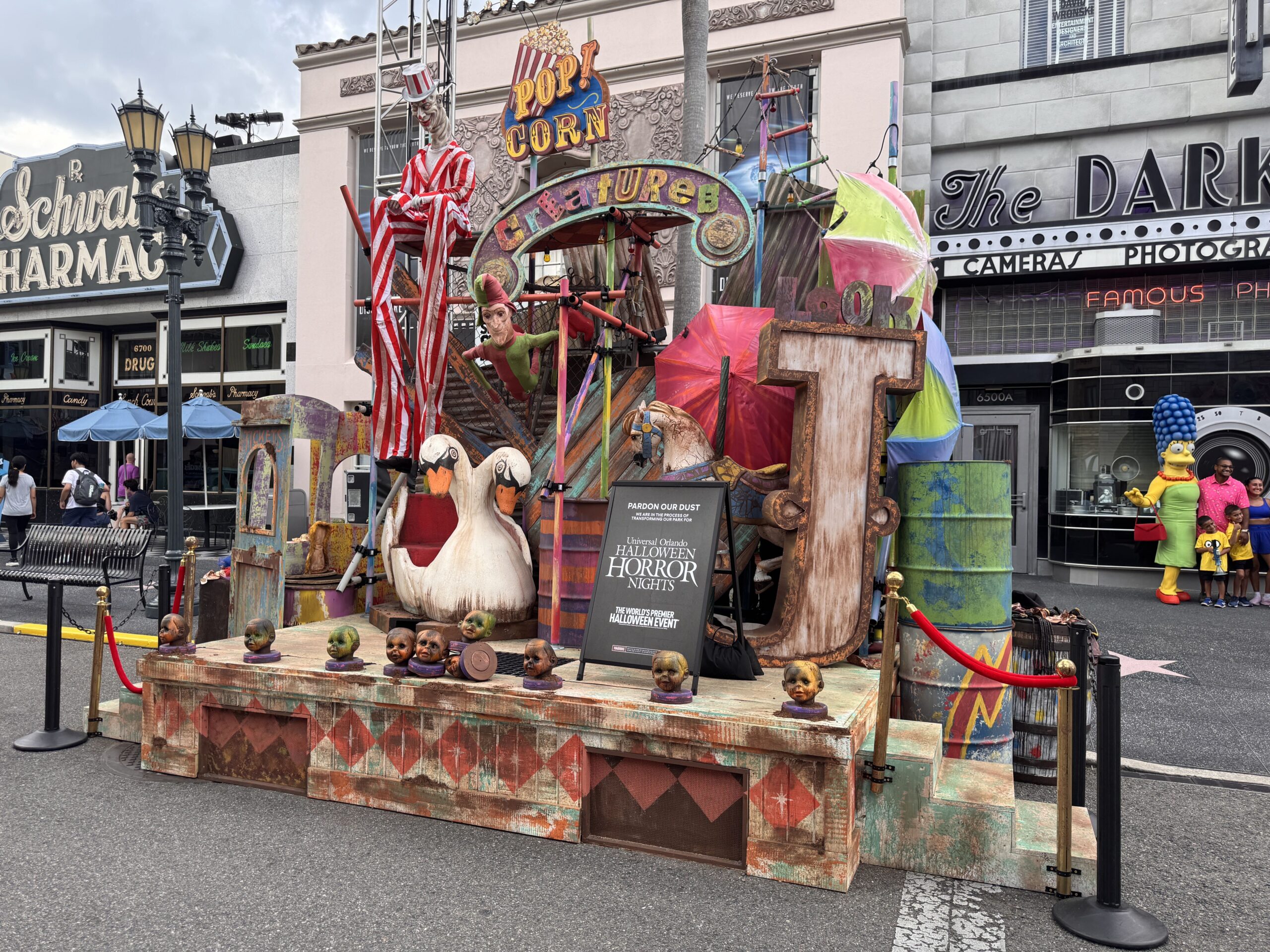 This stage of strange creatures includes a two-headed swan boat and carousel horse. Recent additions include a stilt-walker mannequin and colorful umbrellas.
