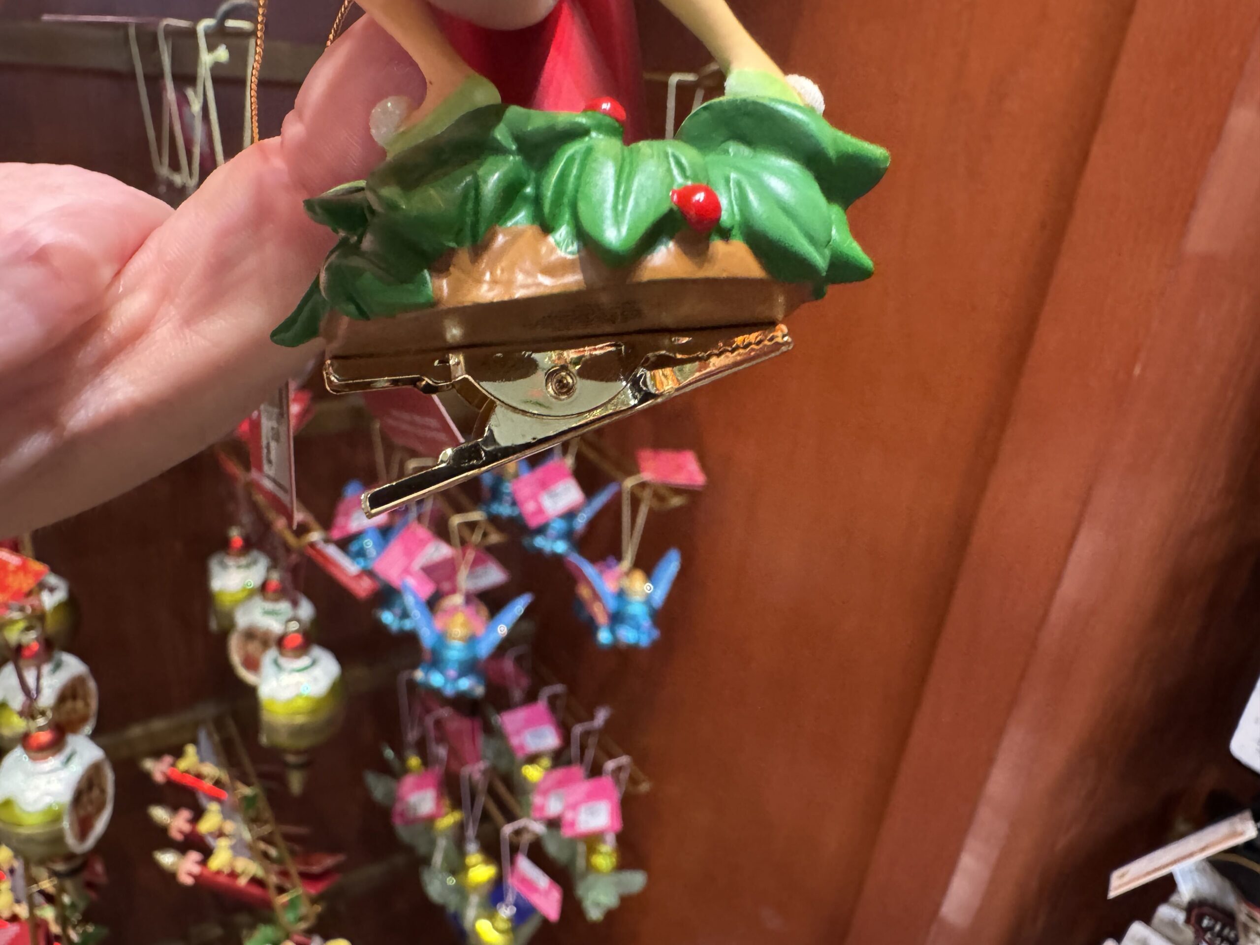 This is a different type of ornament that features a metal clip on the bottom of the figurine to attach to a branch or object rather than hang. 