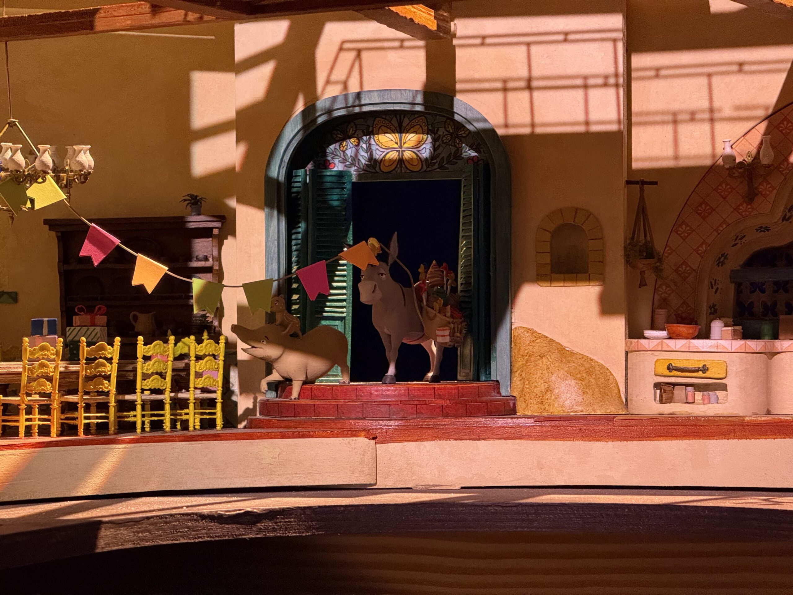 At D23: The Ultimate Disney Fan Event, Walt Disney Imagineering shared a model of the Encanto ride coming to Disney's Animal Kingdom, revealing a scene guests will experience. There are also models of the ride vehicles and animatronics.