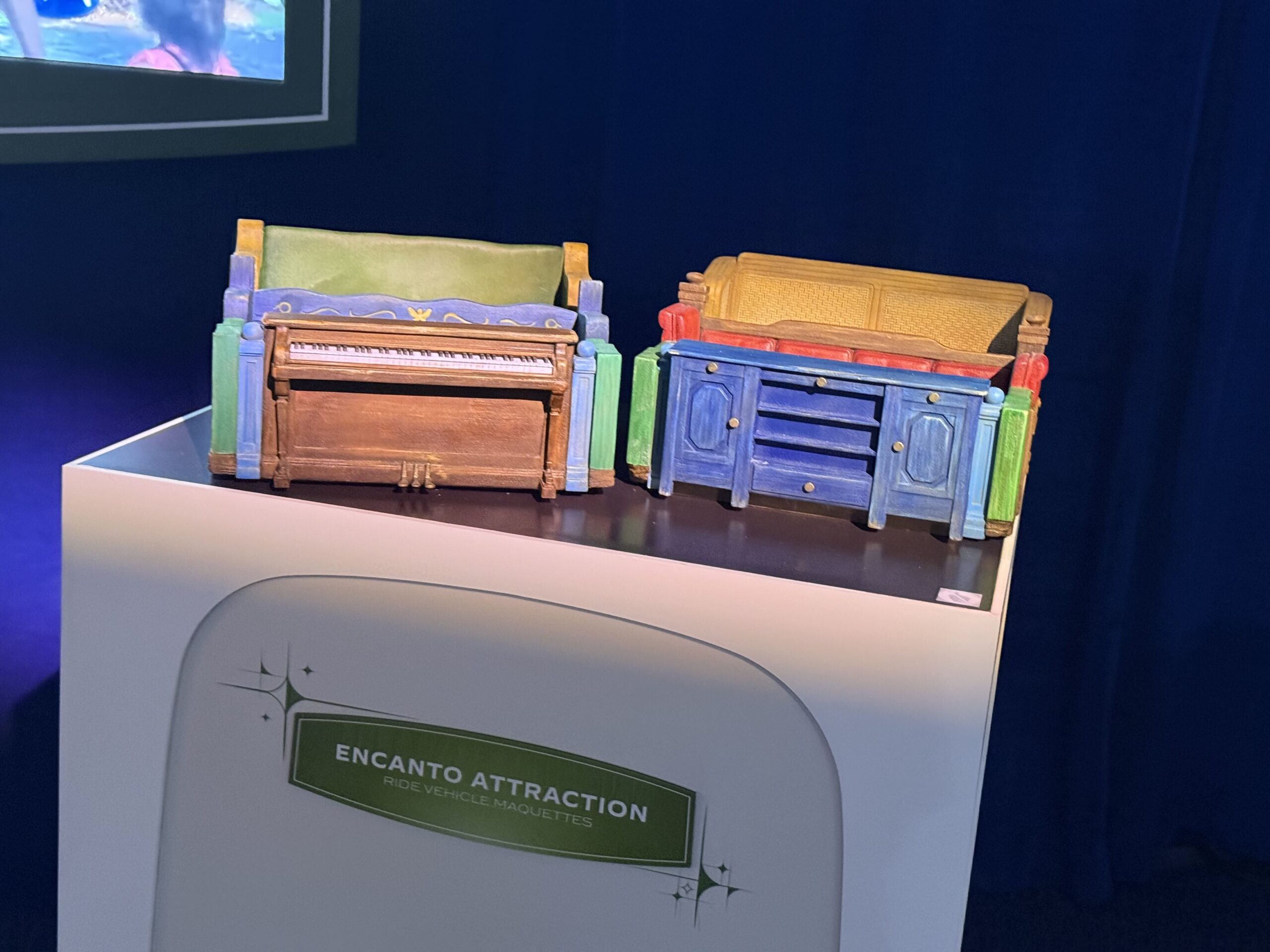 At D23: The Ultimate Disney Fan Event, Walt Disney Imagineering shared a model of the Encanto ride coming to Disney's Animal Kingdom, revealing a scene guests will experience. There are also models of the ride vehicles and animatronics.