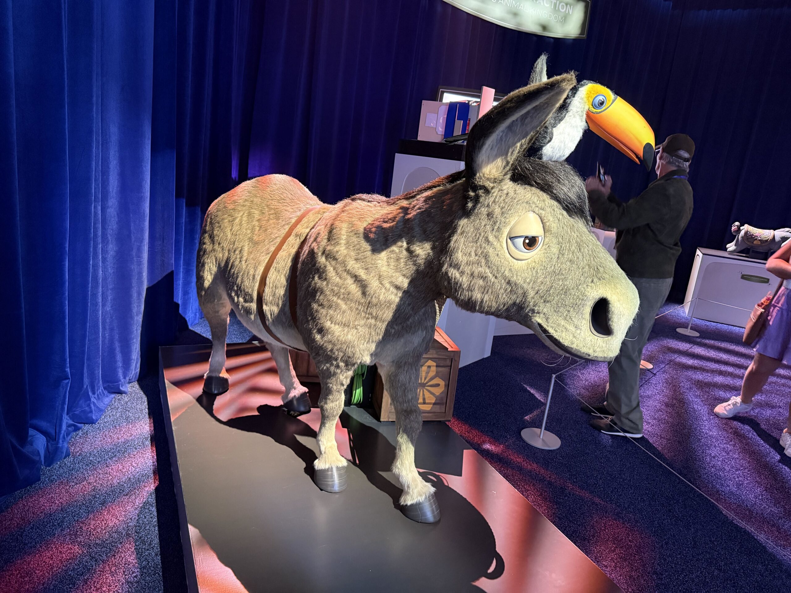 At D23: The Ultimate Disney Fan Event, Walt Disney Imagineering shared a model of the Encanto ride coming to Disney's Animal Kingdom, revealing a scene guests will experience. There are also models of the ride vehicles and animatronics.