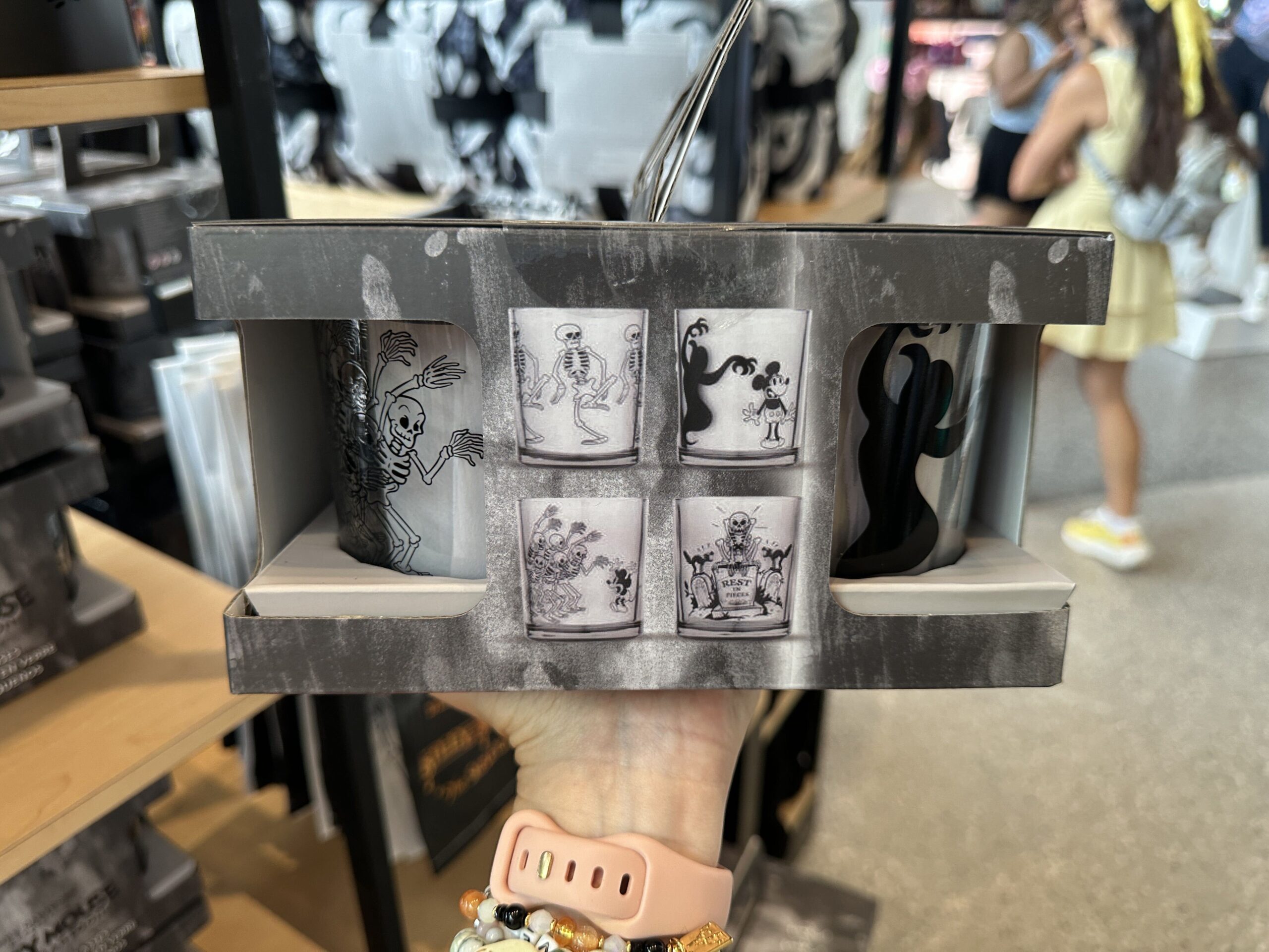 Four different scenes from "The Skeleton Dance" are depicted on these four short glasses. One is of the skeletons dancing, another of a ghost sneaking up on Mickey, the third of the skeleton horde scaring Mickey and the fourth of black cats and a skeleton in a cemetery.