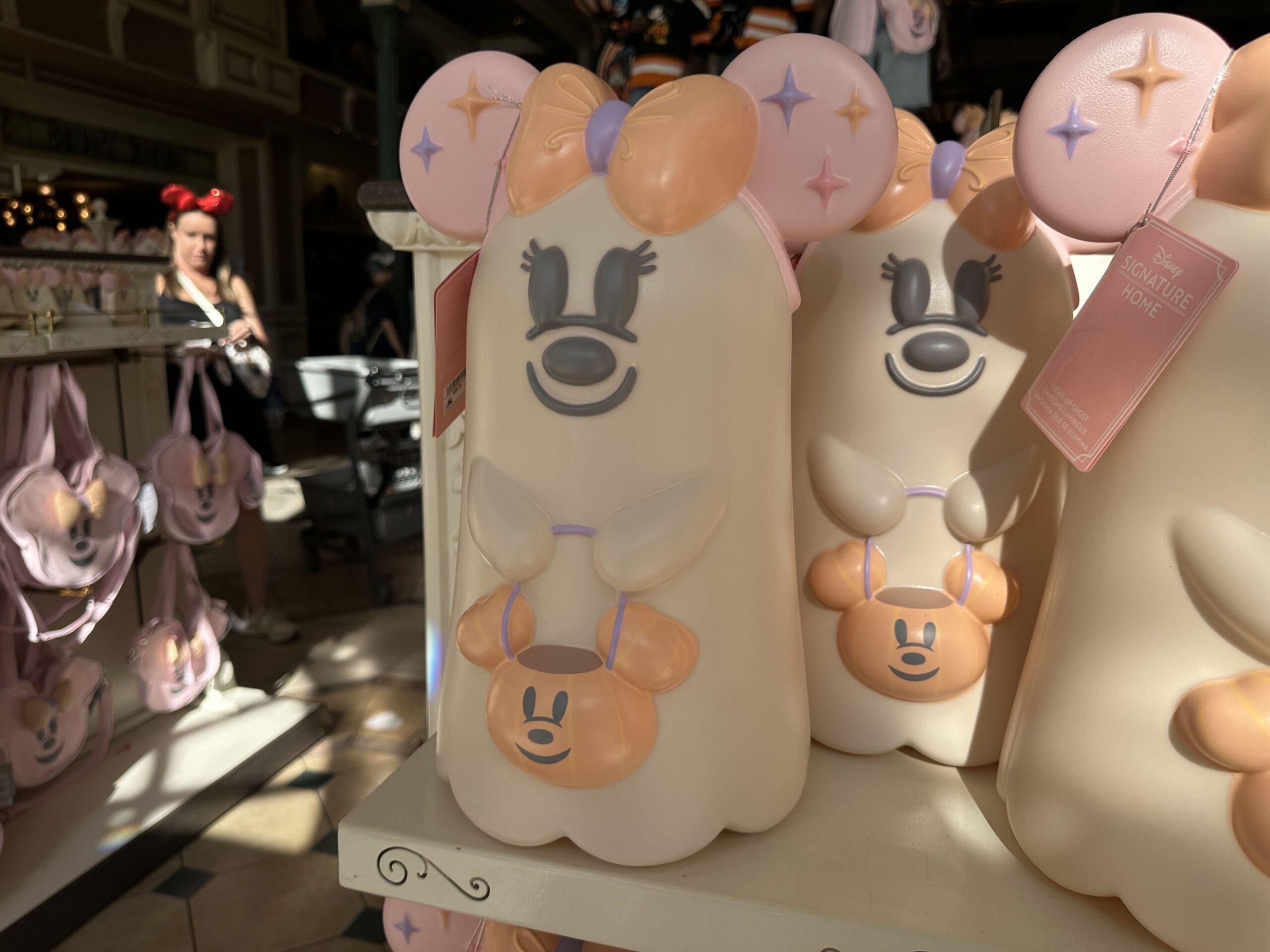The blow mold is in the shape of Minnie as a ghost. She wears her bow and carries a candy bucket. She glows in the dark.