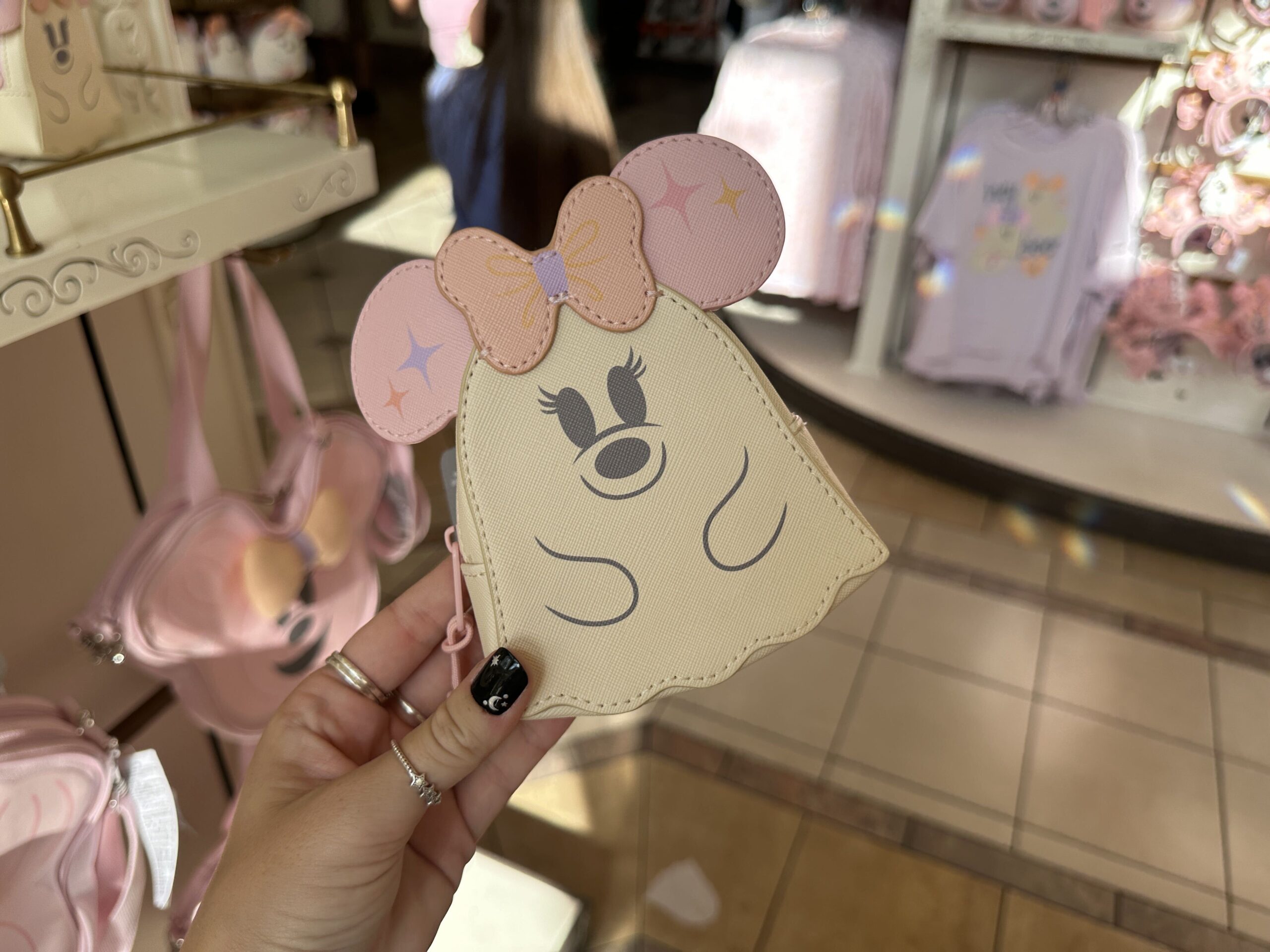 The Minnie ghost-shaped coin pouch showcases her pink ears and bow.