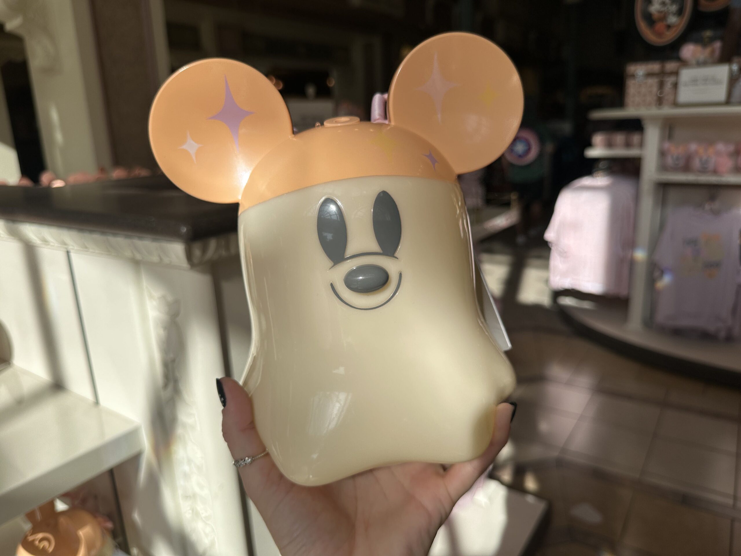 This bubble machine is in the shape of a Mickey ghost—with his orange ear hat. It has a pink strap so it can be carried around the parks.