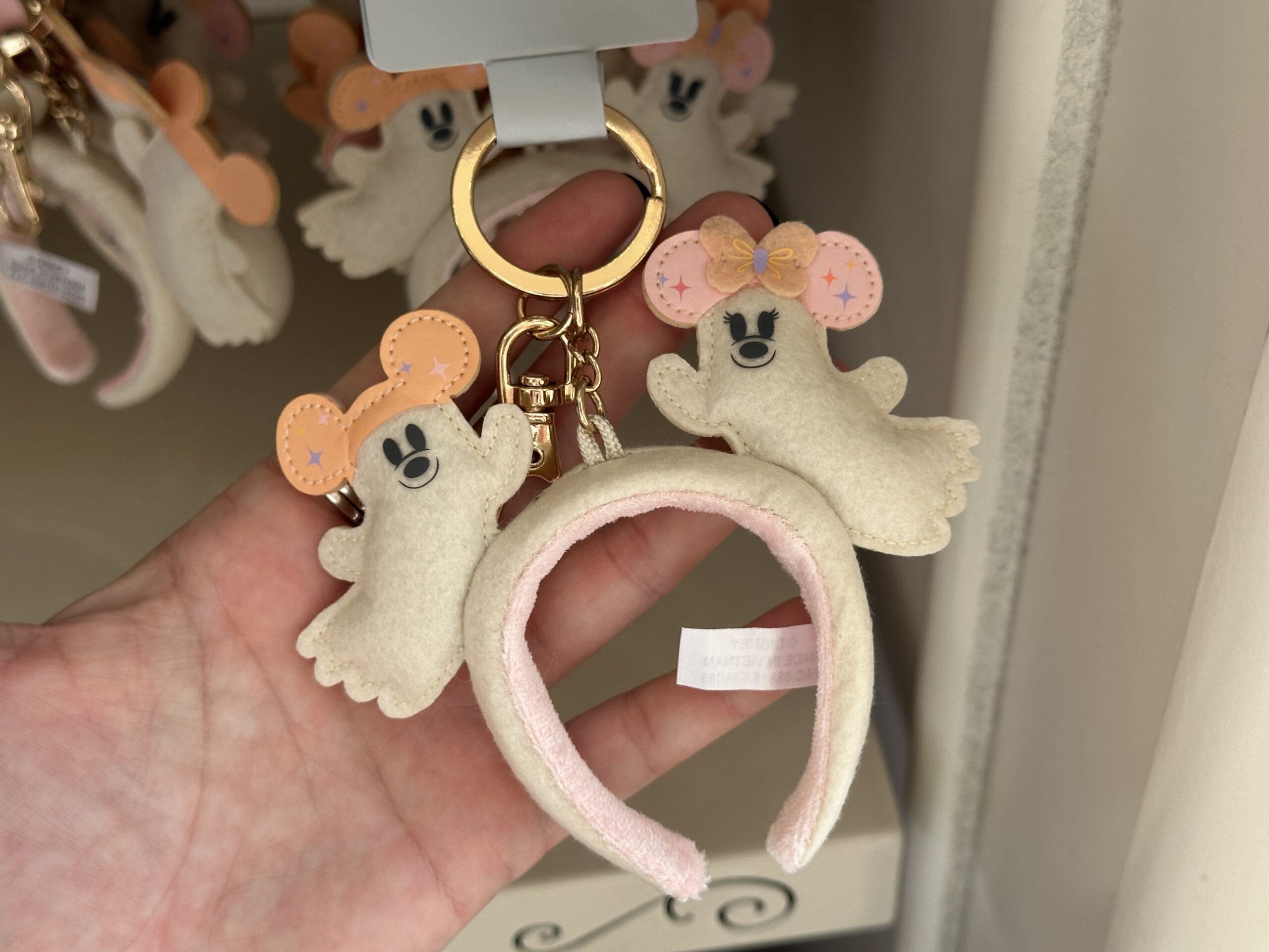 A miniature ear headband featuring Mickey and Minnie Ghosts is available to purchase as a bag charm.