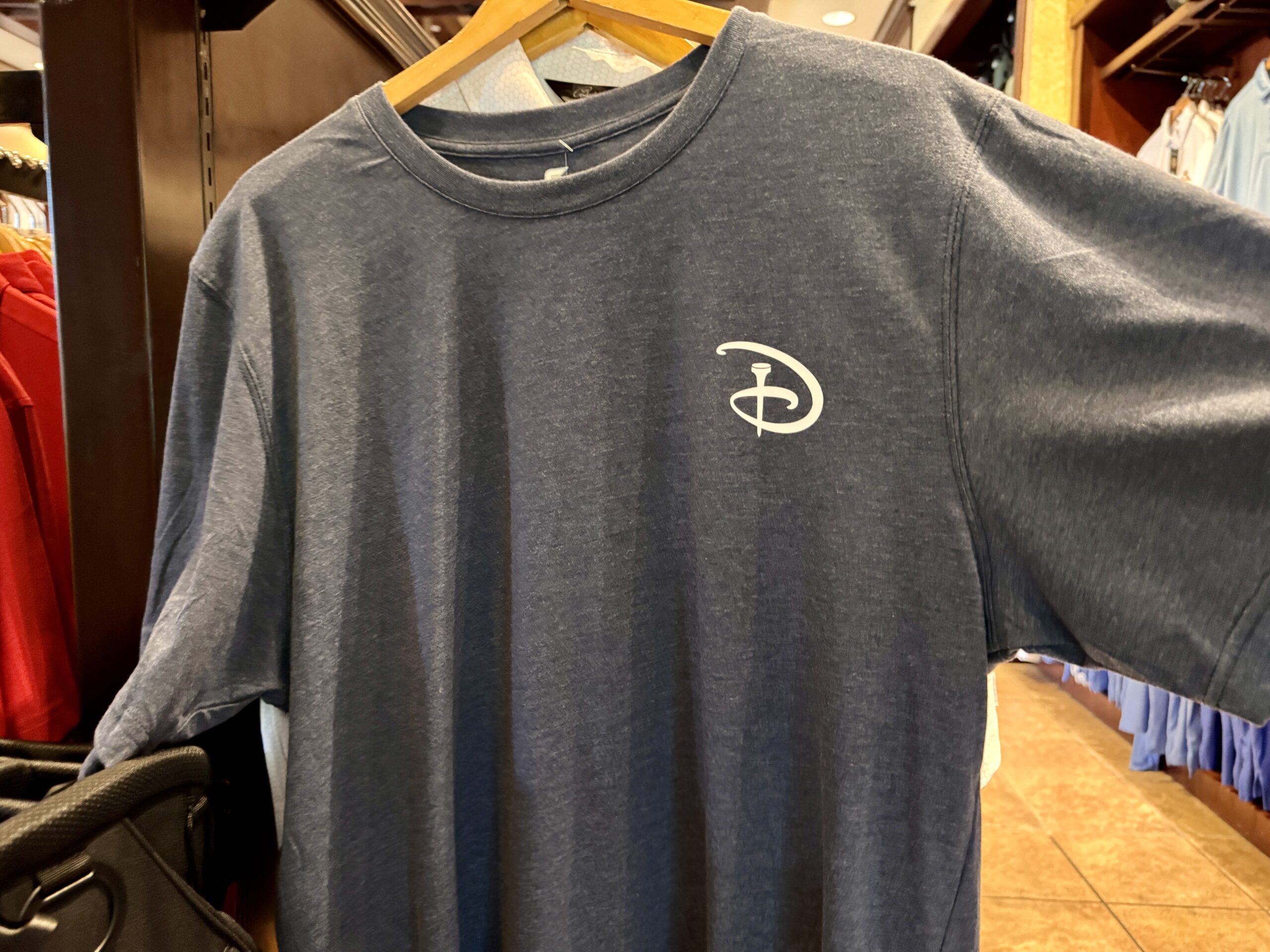 Gray golf shirt available at Palm and Magnolia pro shop at Walt Disney World