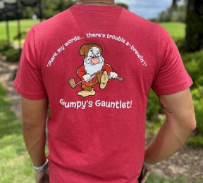 Red golf shirt available at Palm and Magnolia pro shop at Walt Disney World