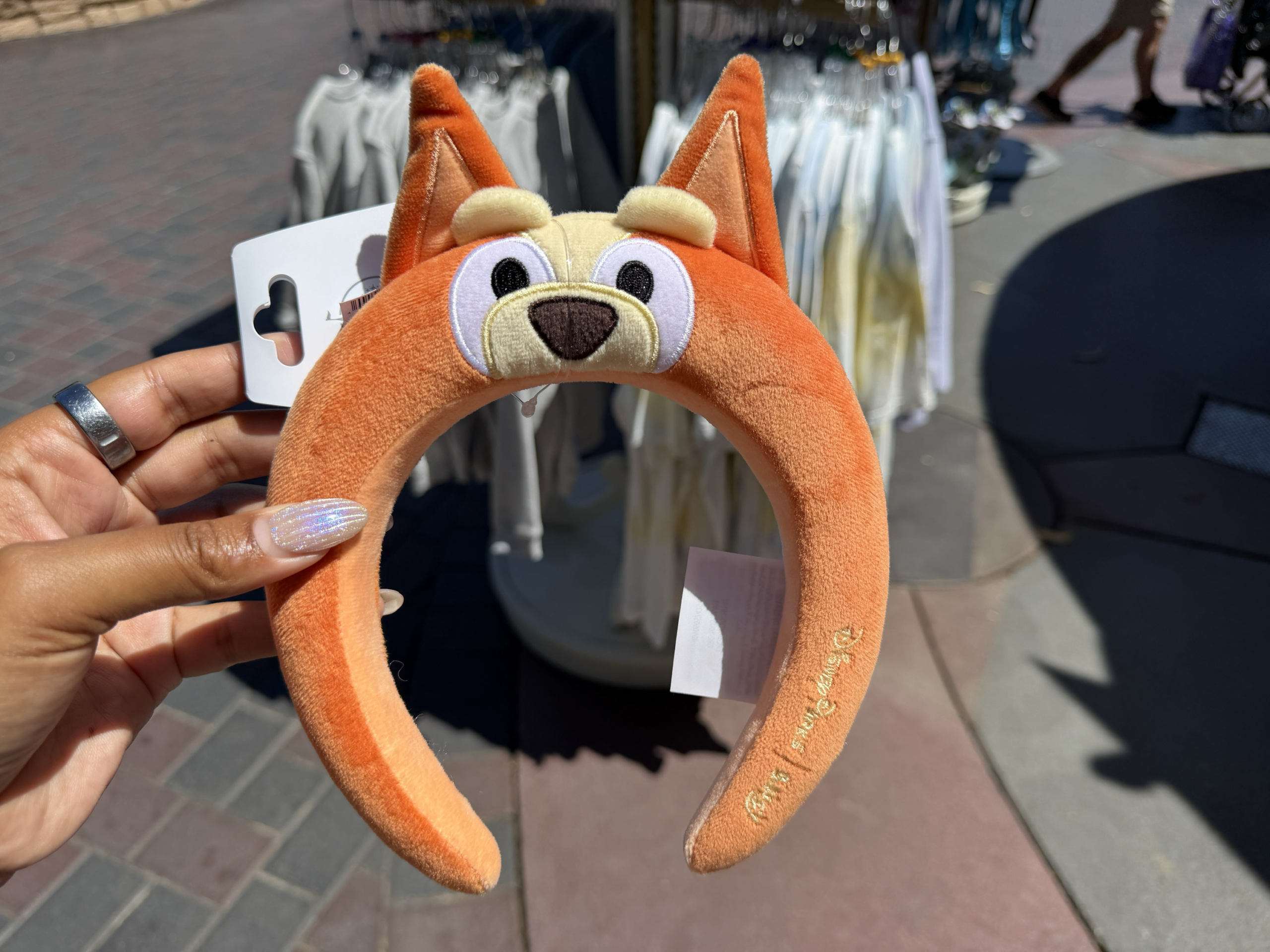 New Bluey merchandise has arrived in Disneyland, including plush ear headbands and a bubble wand.