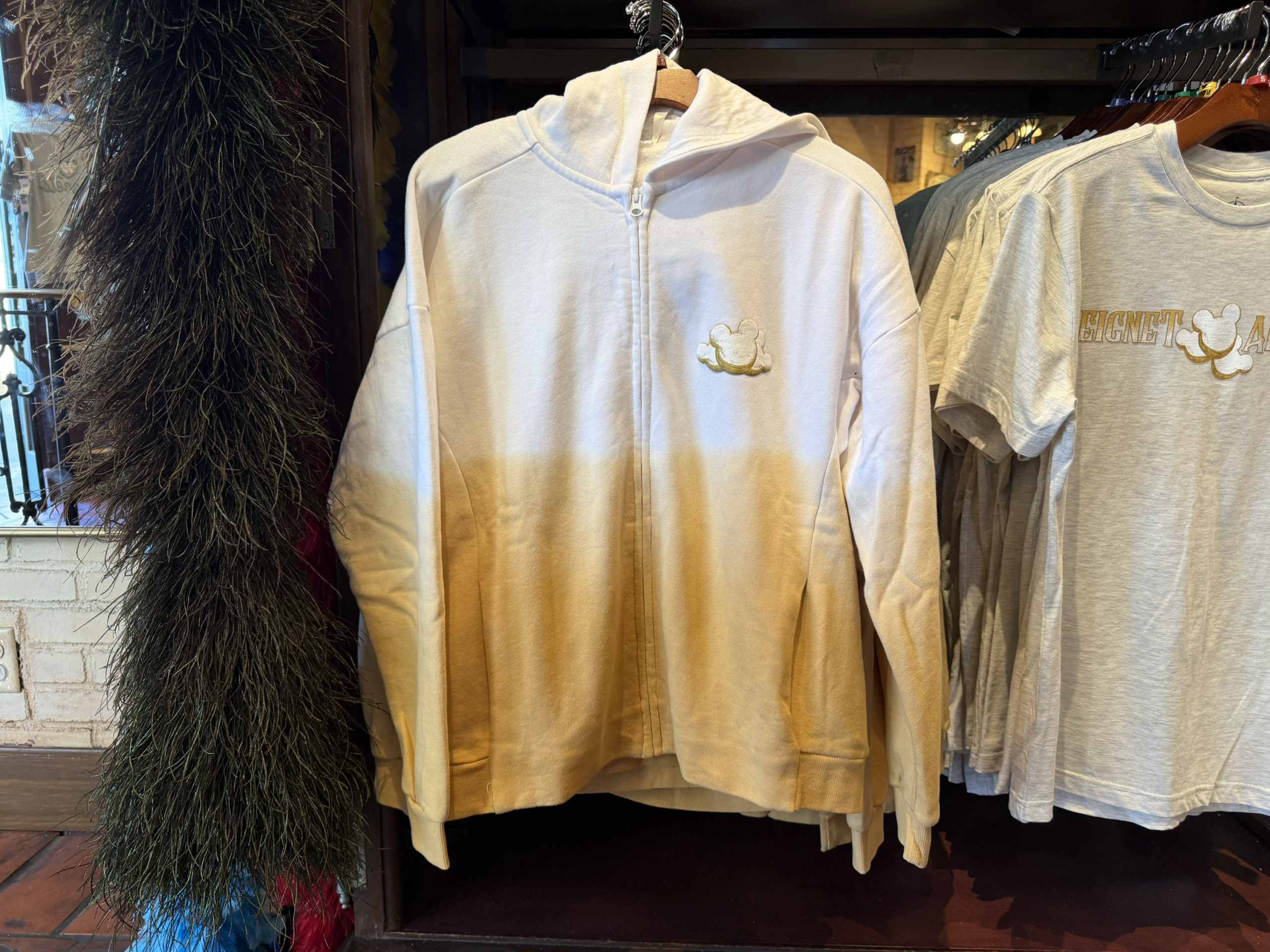 New Beignet All Day Zip Hoodie and Tea Towel Arrive at Disneyland